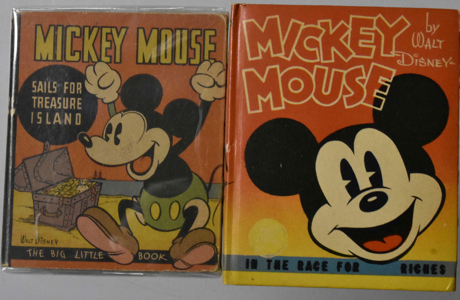 2 Mickey Mouse Treasure Big Little Books: Including Mickey Mouse Sails for Treasure Island Premium No# (Blue Back) 1935 and Mickey Mouse in the Race for Riches #1476 1938. Books vary from Fine to NM.