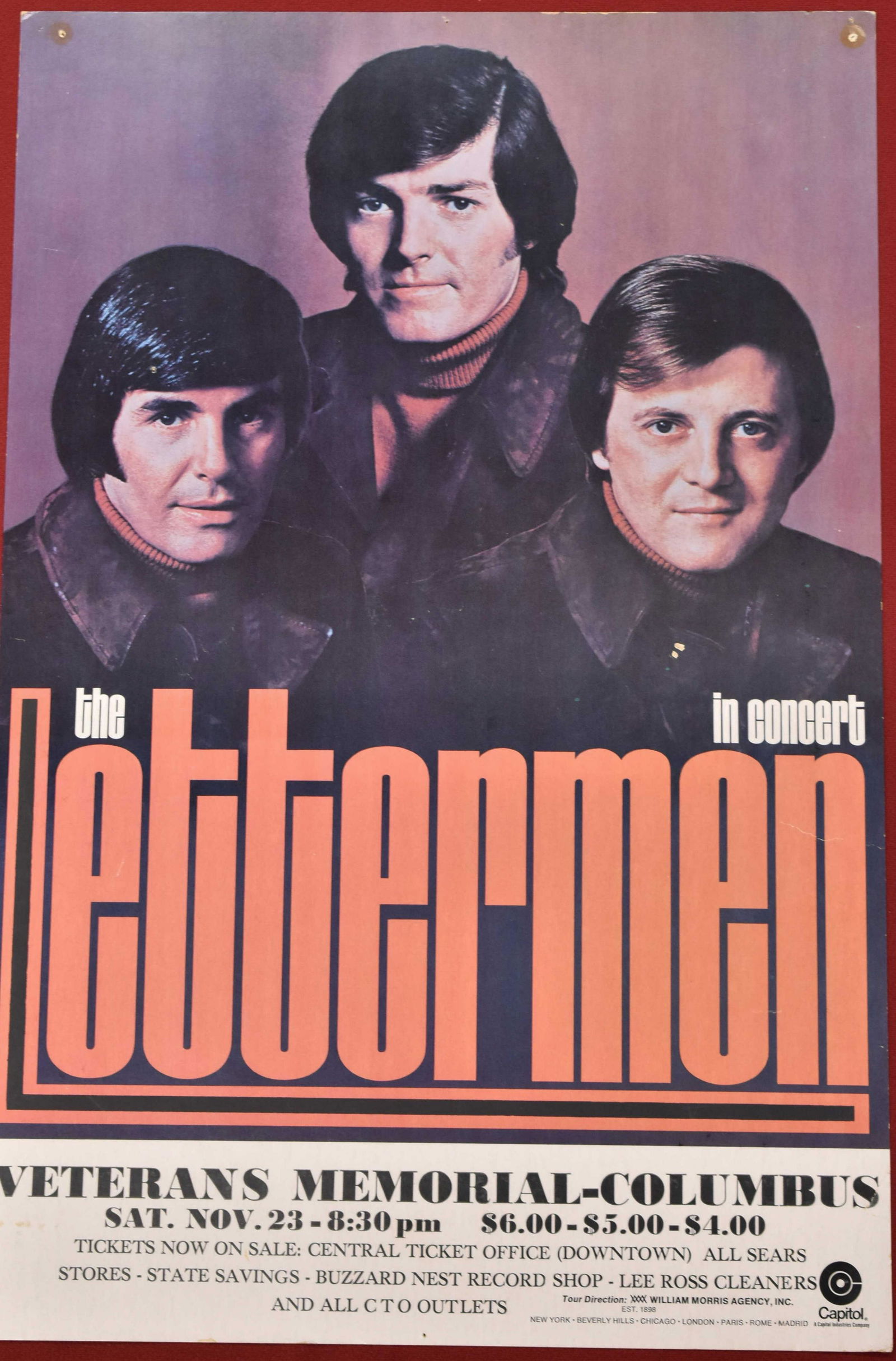 Vintage The Lettermen Concert Poster: The Lettermen at the Veterans Memorial - Columbus. November 23, 1973 or 1974. Tour Direction William Morris Agency. Has push pin holes at top L and R and scratch/chip. Poster size approx 14" x 21 1/2"