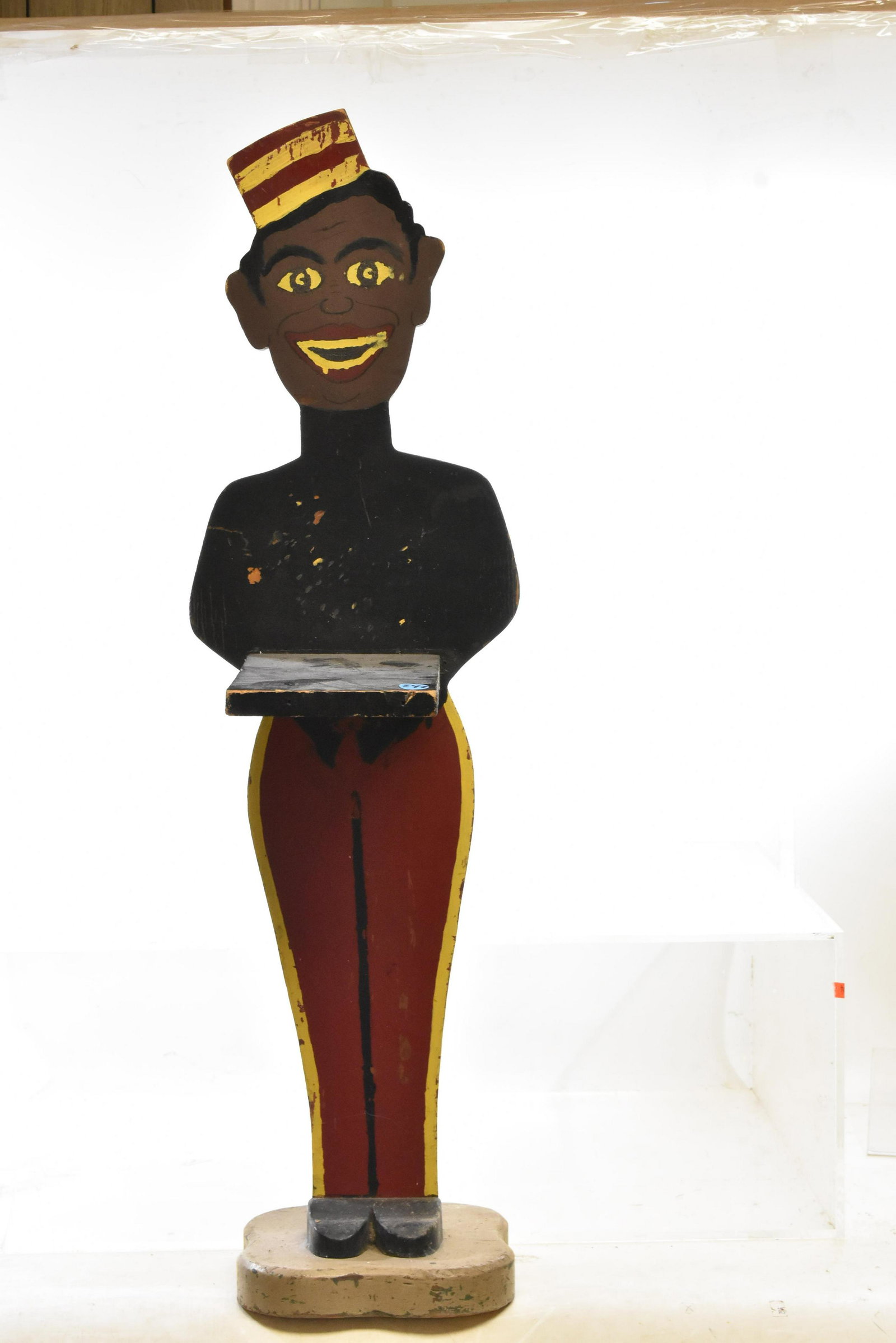 Black Americana Painted Wooden Display Stand: Mid 20th century stand with original paint. Paint condition consistent with age.