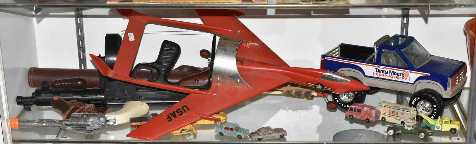 Mixed Toy Grouping: A Cox style airplane (engine is free), a toy machine gun and pistol and various toy vehicles.