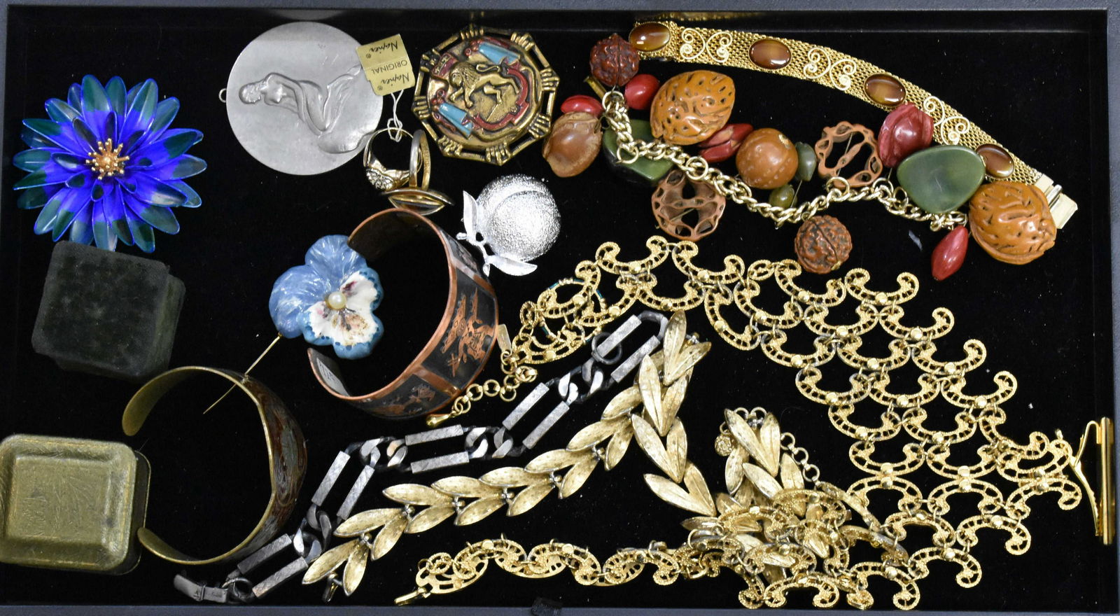 Quality Vintage Jewelry: Napier sweetheart ring, a Bakelite nut bracelet, a Native copper bracelet, a gold tone Monet bib necklace, a pendant with nude marked "Georg Jenson Denmark", a Coventry peach pin and other quality jew