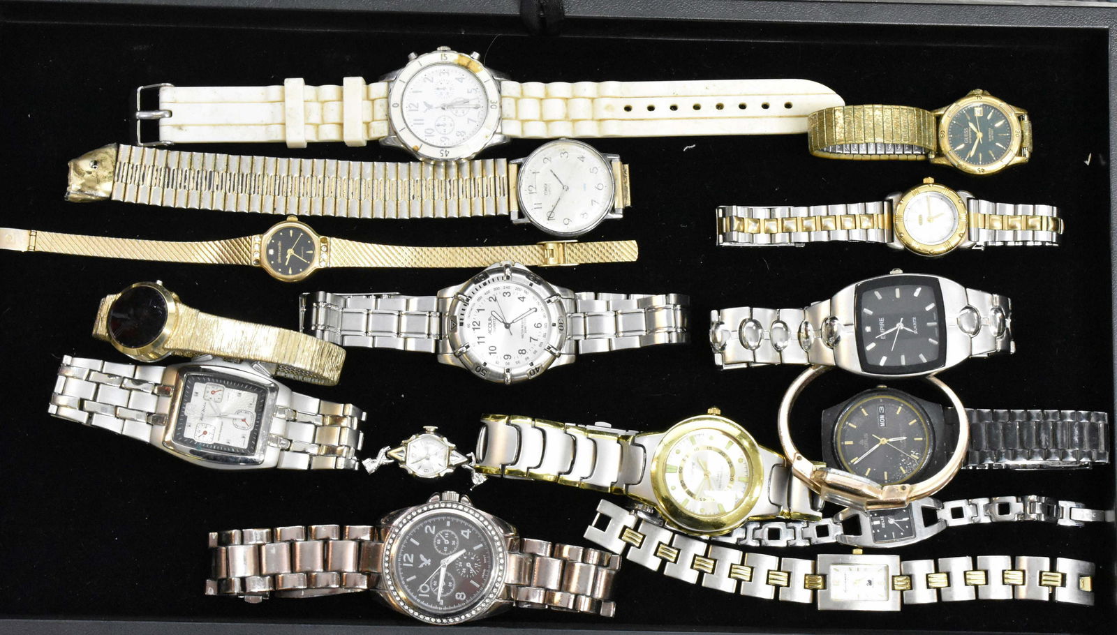 Large Assortment of Wrist Watches: Men's watches include an "Acqua" stainless steel watch, a "Paul Jardin" with three chronometers, an Empire with a stainless body and others. Lady's watches include a gold tone "Guess" with date, a "Re