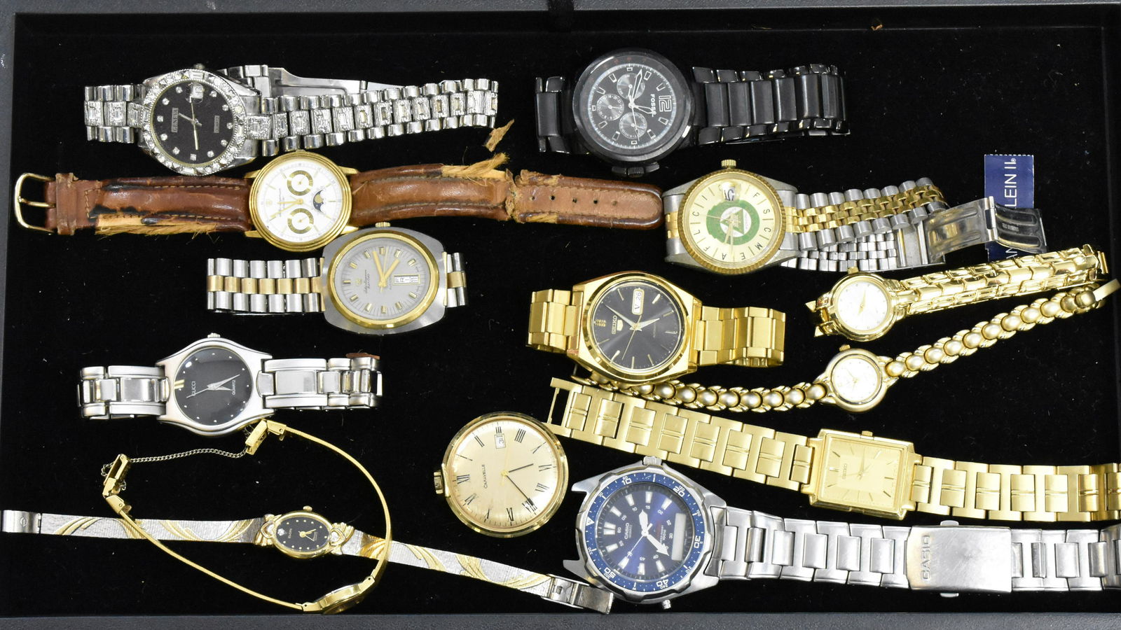 Large Assortment of Watches: Including a black men's Fossil diver's watch, a men's Casio with a blue face, a men's Seiko automatic with day and date and others. Lady's watches include Anne Klein, Vivani, Seiko and others.