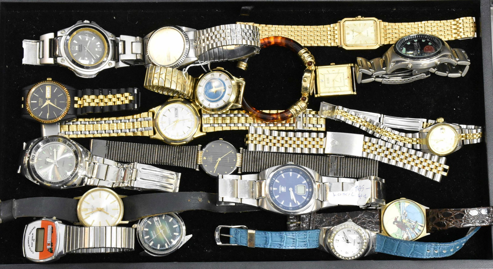 Collection of Wrist Watches: Including several "Bijoux Turner" diver's watches, a man's Pierre Cardin, a Fossil Blue and others. Lady's watches include Joan Rivers, "Lord Walco" marked Swiss Made and others.