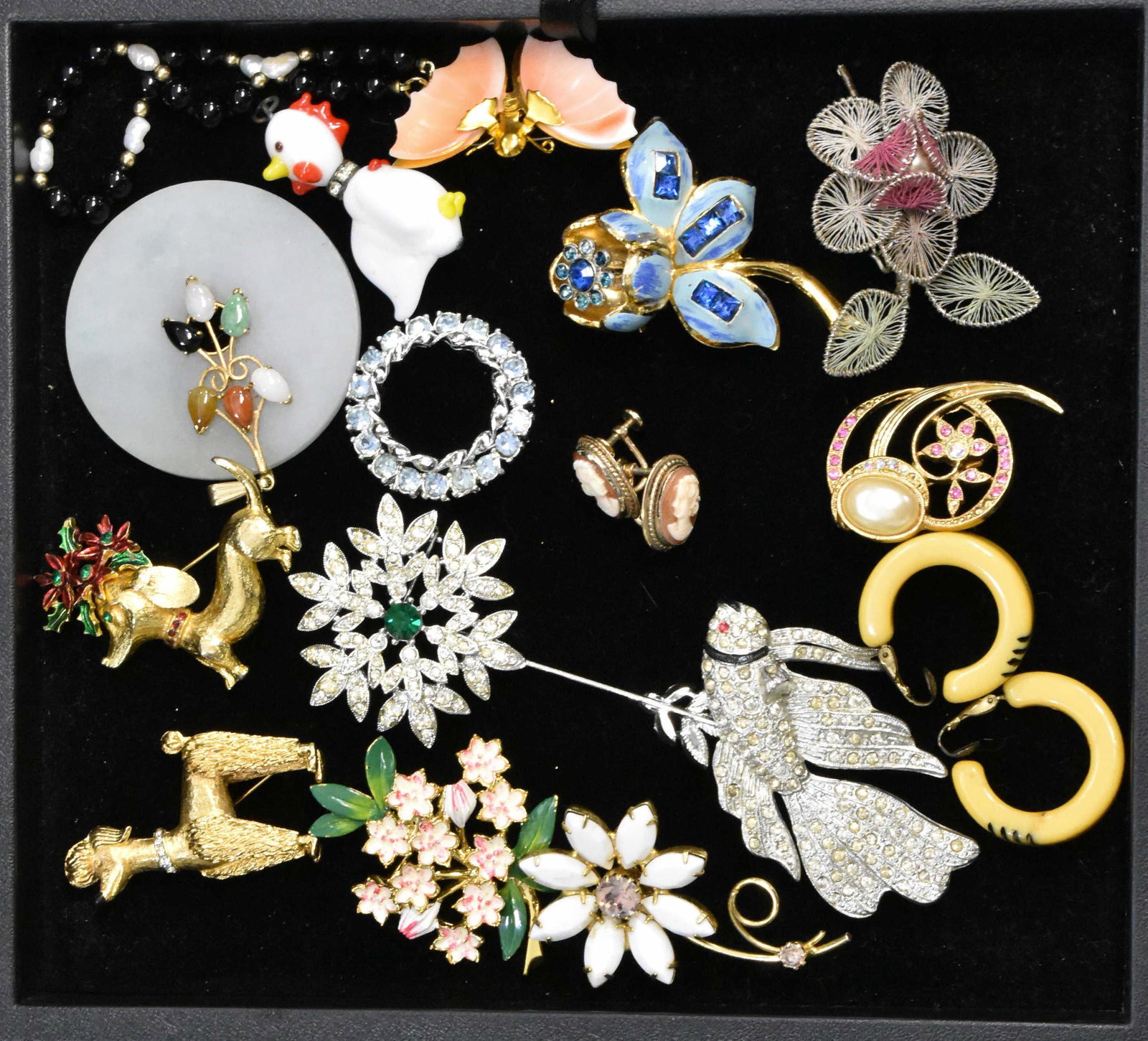 Figural and other Costume Jewelry: Including a Beta fish pin, two dog pins, floral pins - some with rhinestones, a pair of Bakelite clip earrings and other quality items.