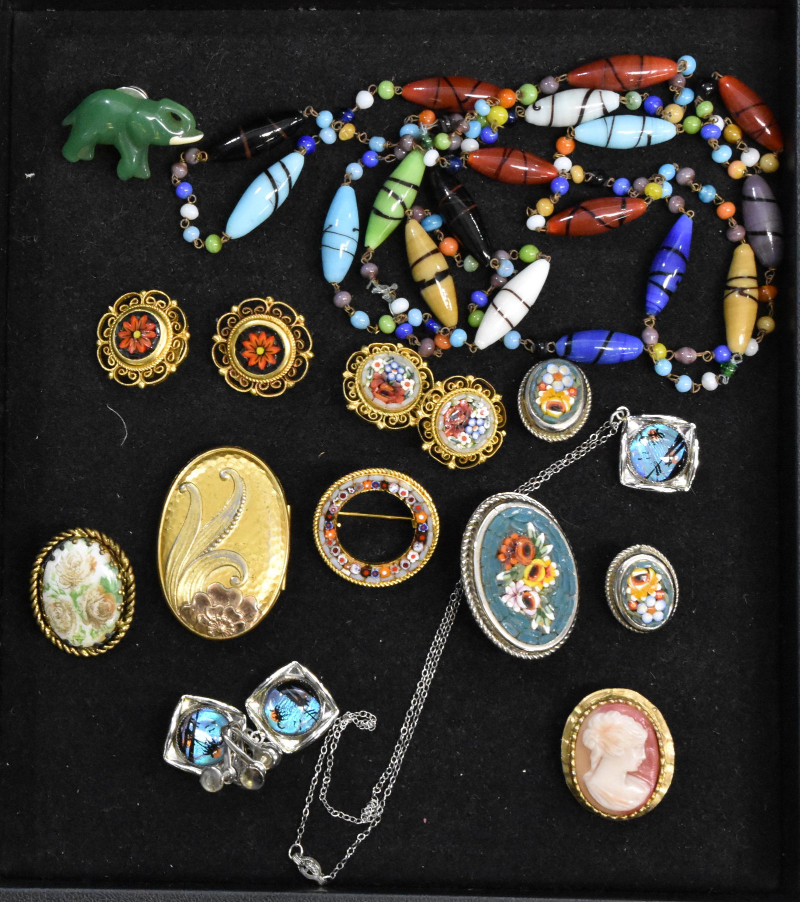 Micro Mosaic and other Quality Jewelry: Micro mosaic floral pin, two pair of micro mosaic clip earrings, a cameo, an Art Nouveau locket with photo and hair and other quality items.