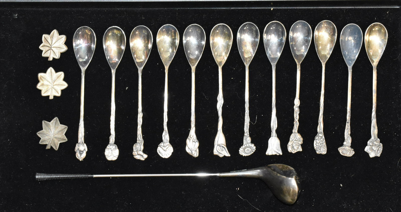 Art Nouveau Spoons and more: Twelve Art Nouveau spoons with floral tops - each having a fox hallmark, a miniature golf club marked "Frigast Made in Denmark" and three leaf lapel pins.