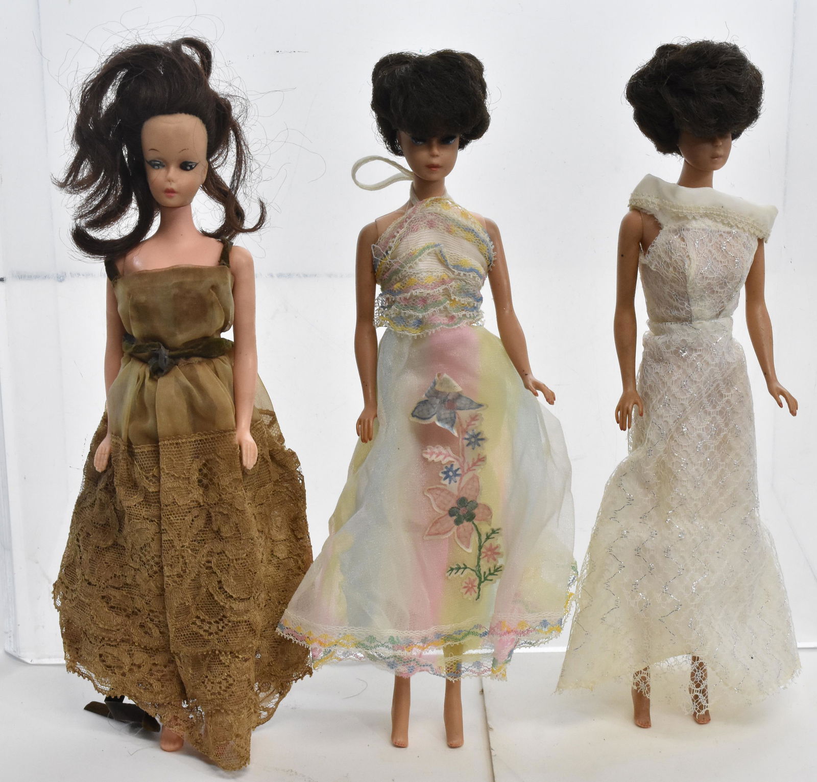 Three Vintage Midge Barbie Dolls: Two are dated 1962 and one is in a gown and is unmarked.