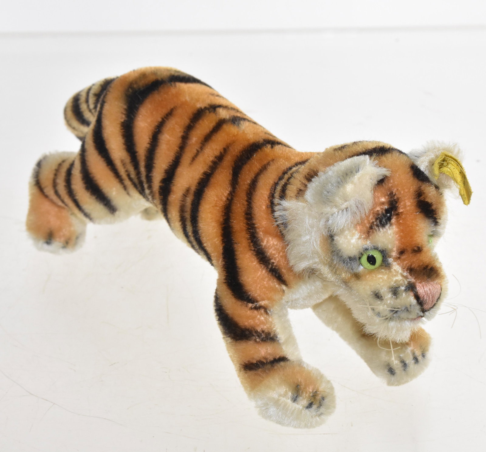 Steiff Tiger: Measures approx. 9" in length not including tail. Item has button and ear tag.