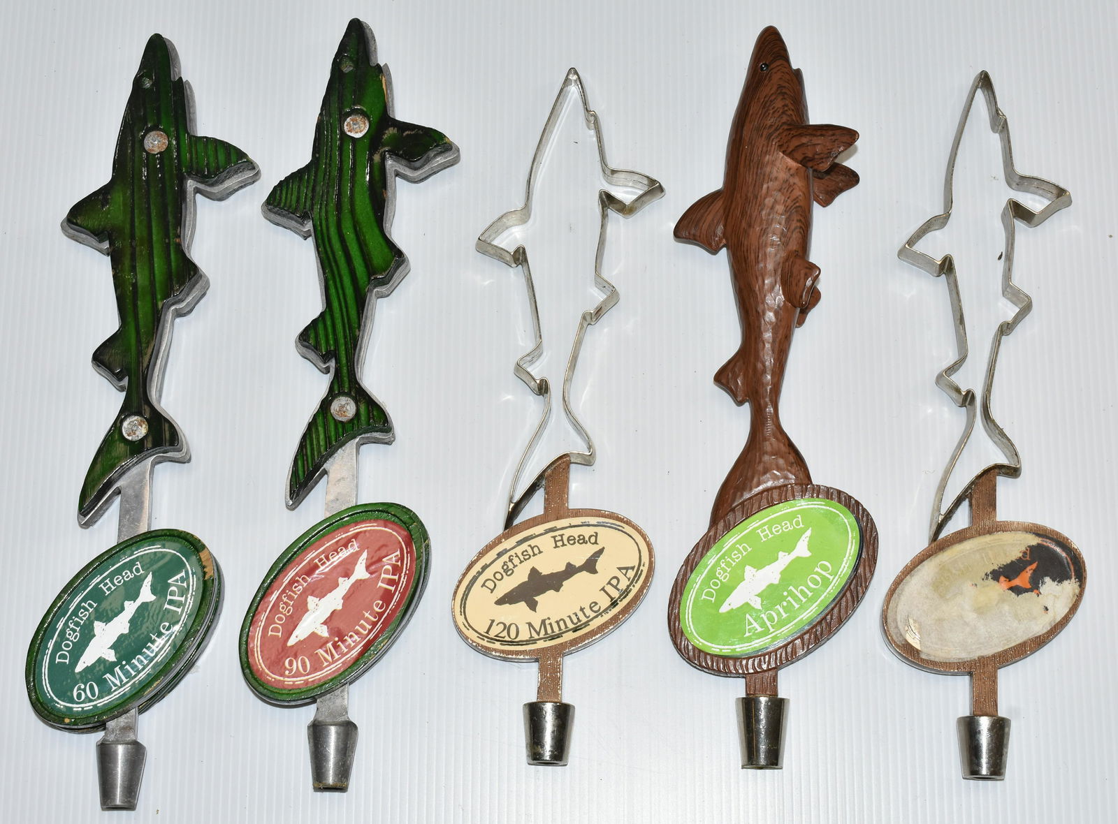 "Dogfish Head" Beer Tap: Five "Dogfish Head" beer taps - one is missing the logo.