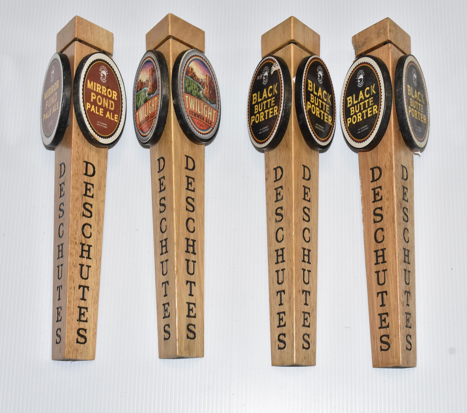 "Deschutes" Beer Taps: Four various beer taps.