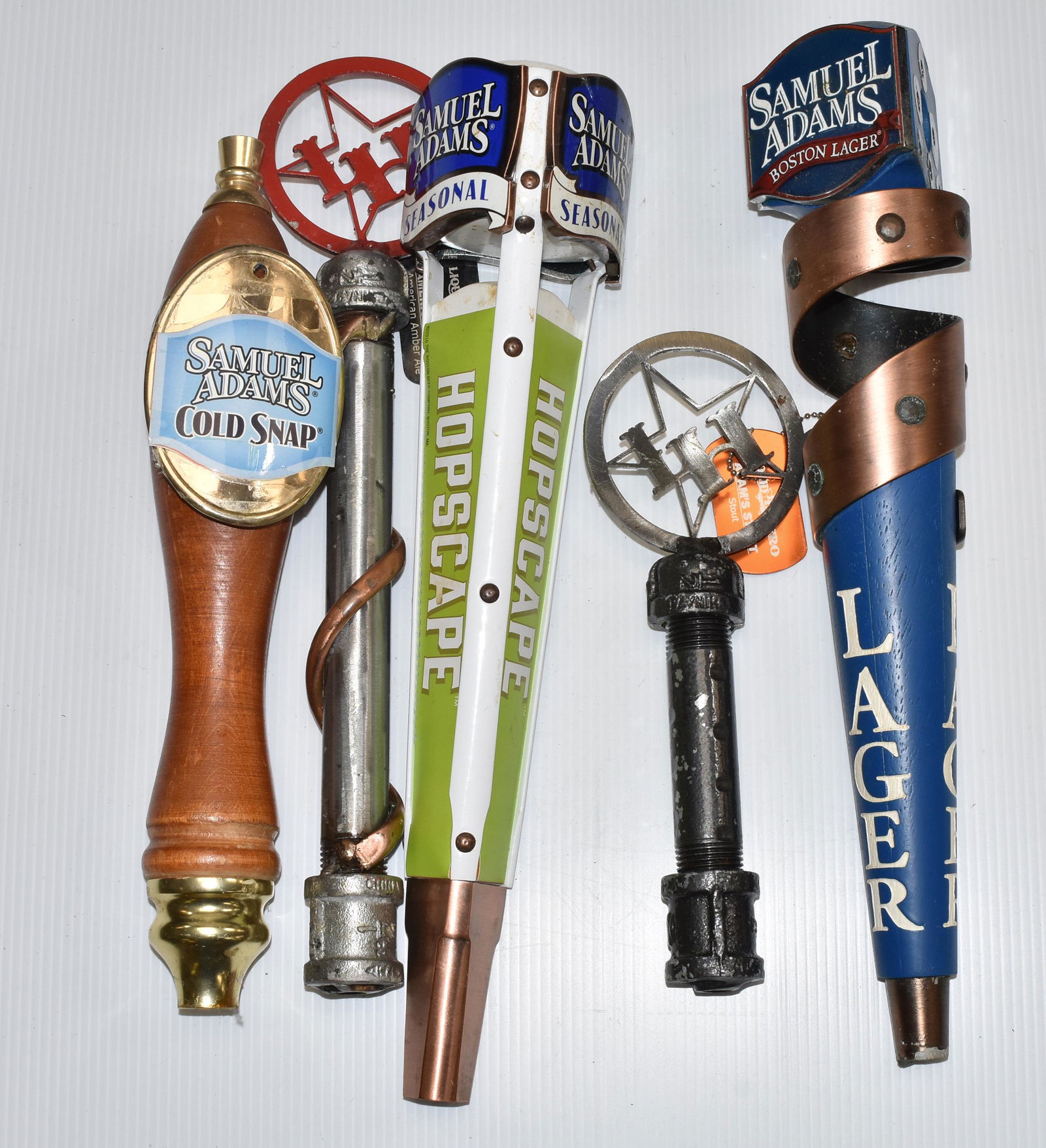 "Liquid Hero" and other Beer Taps: Two "Liquid Hero" beer taps and three Samuel Adams taps - one missing a side plate.