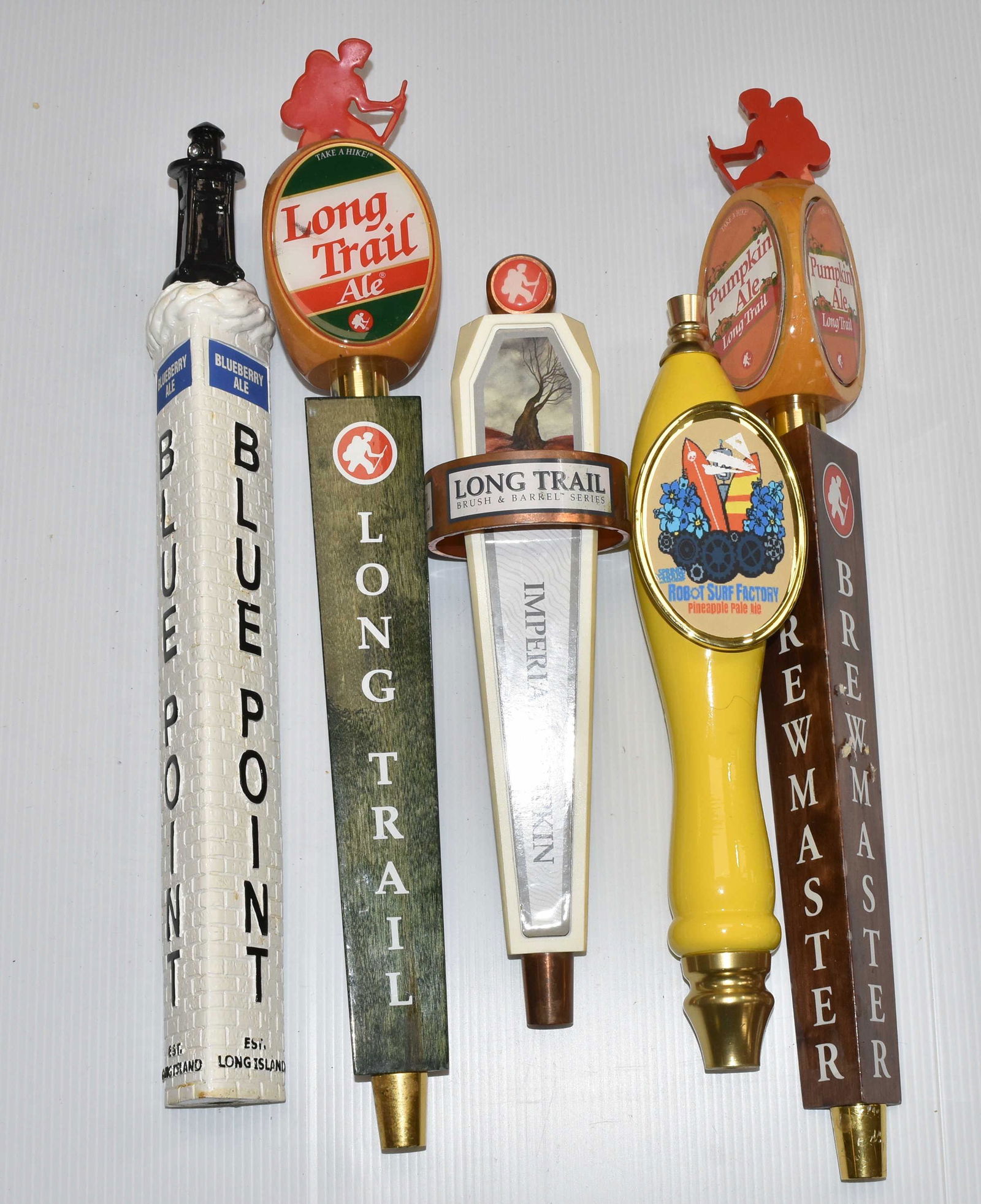 Five Mixed Beer Taps: Including Blue Point, three "Long Trail" taps and one "Robot Surf Factory".