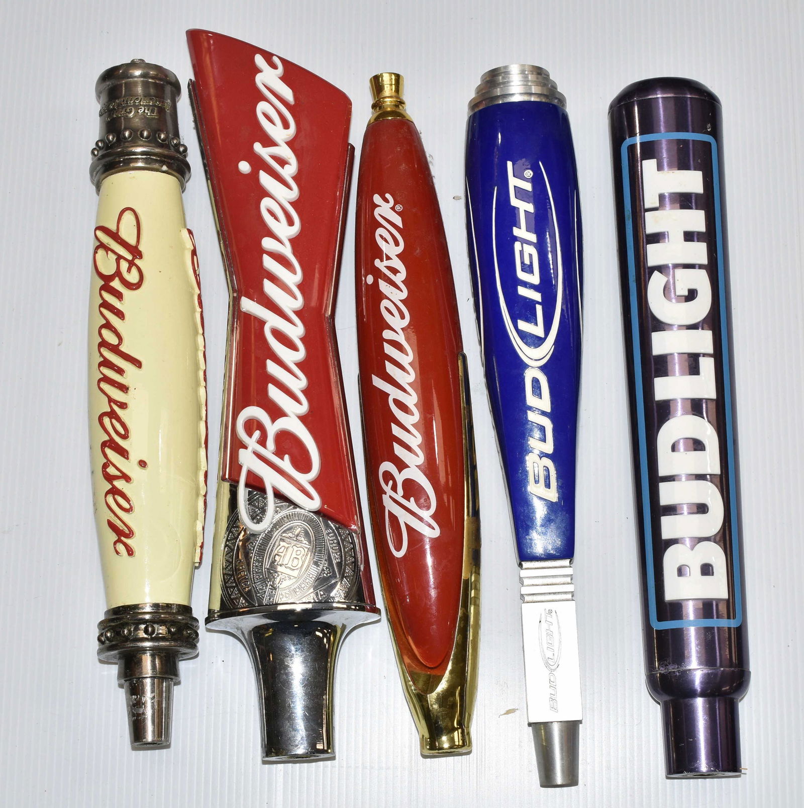 Bud and Bud Light Beer Taps: Five various Bud and Bud Light taps.