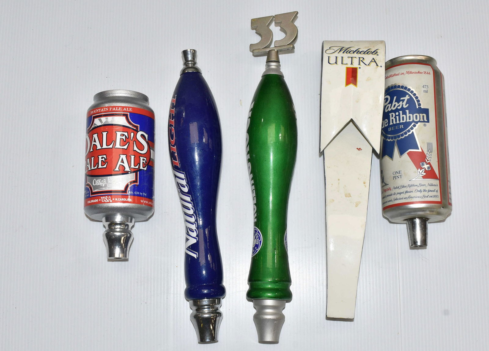 Mixed Beer Tap Grouping: Including Rolling Rock, Pabsts, Mickelob and others. Five total pieces.