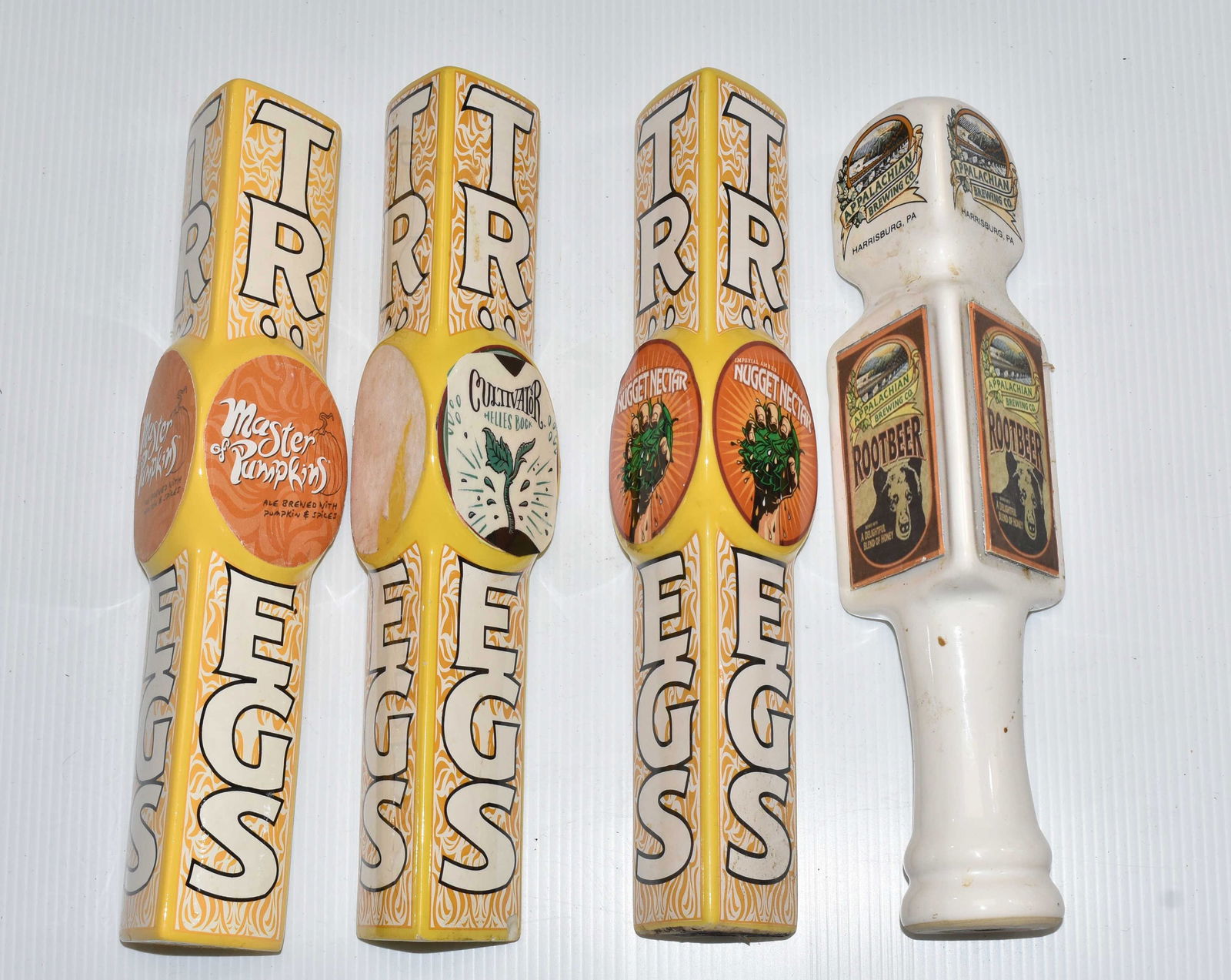 Troges Beer Taps and another: Three Troges beer taps and an Appalachian root beer tap.