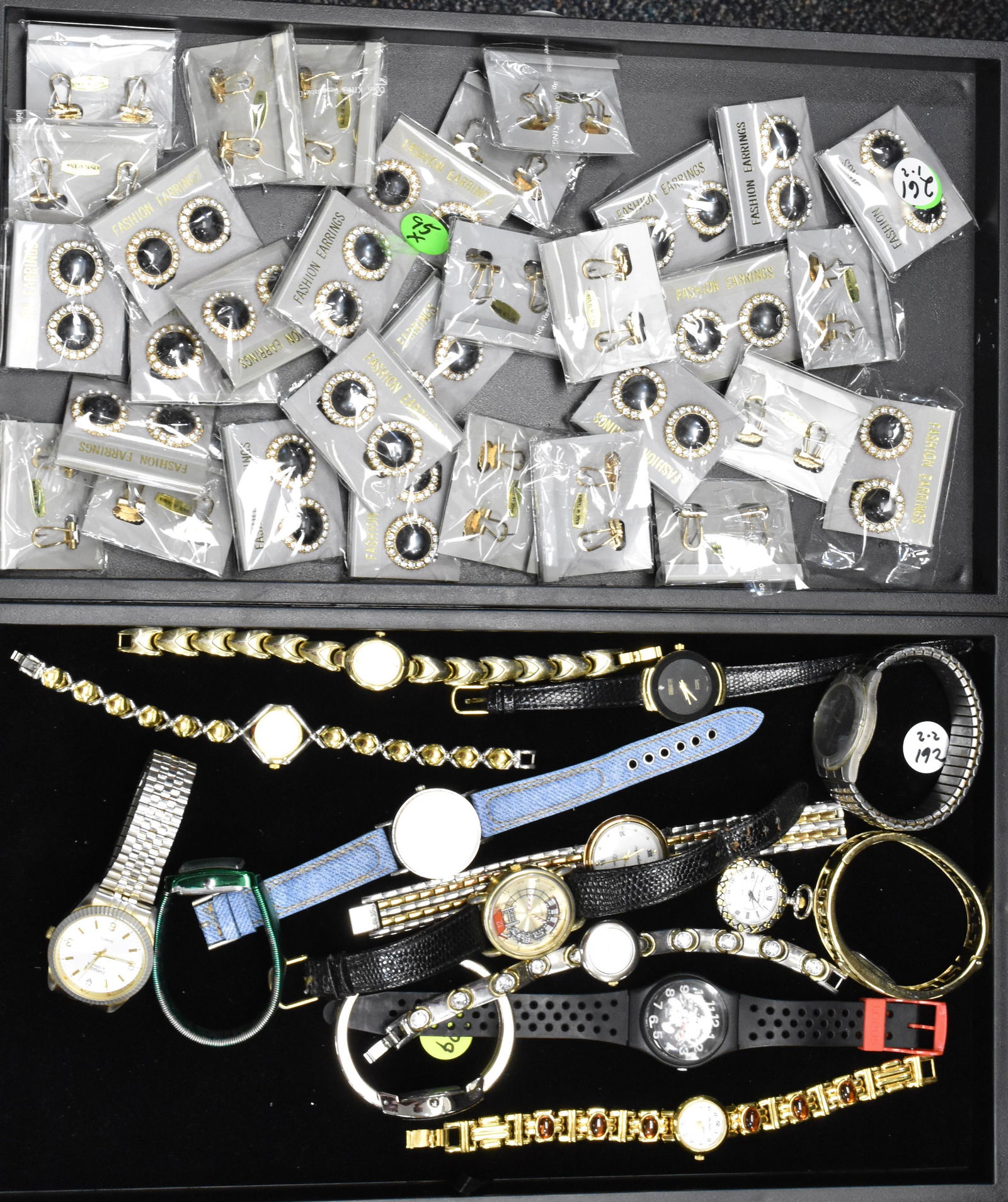 Two Trays of Watches and Costume Jewelry: Men's watches include a Gruen Embassy and a novelty railroad watch. Lady's watches include Vivian, Collier, Lee Sands and others.. Lot also includes a tray of fashion earrings.