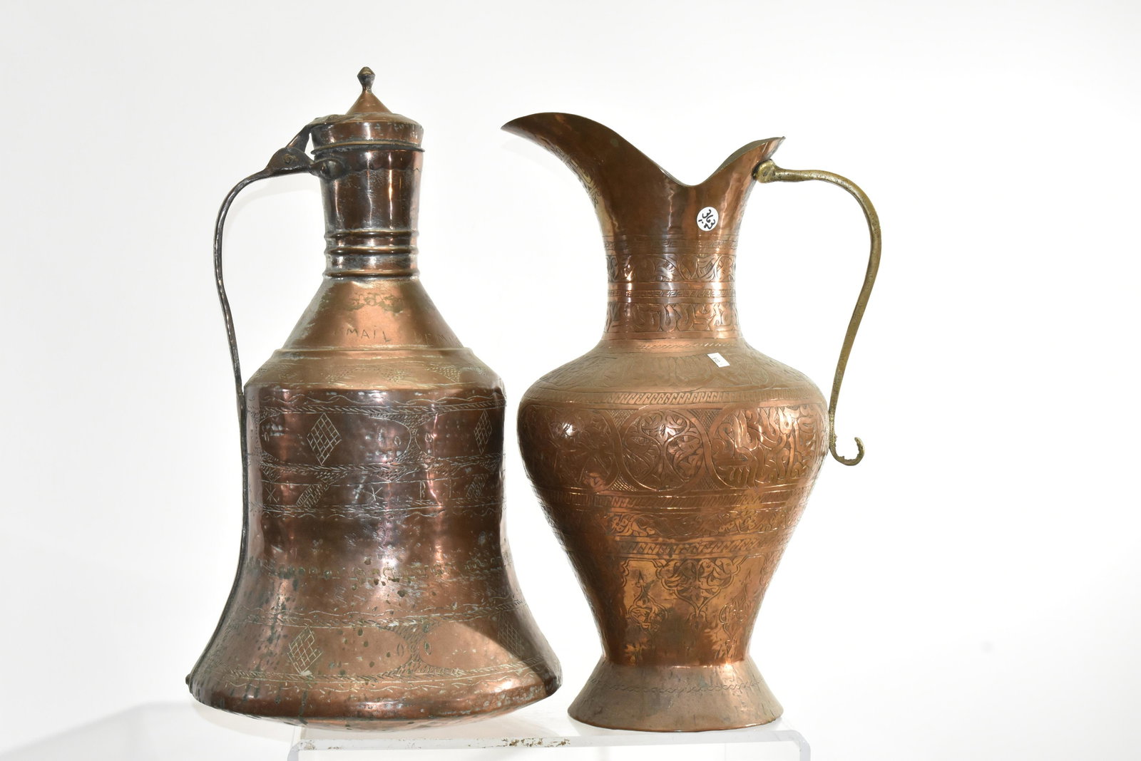 Two Large Copper Vessels: Larger measures approx. 21"h and is a lidded vessel which appears to be from India. The second is a large Middle Eastern water pitcher.
