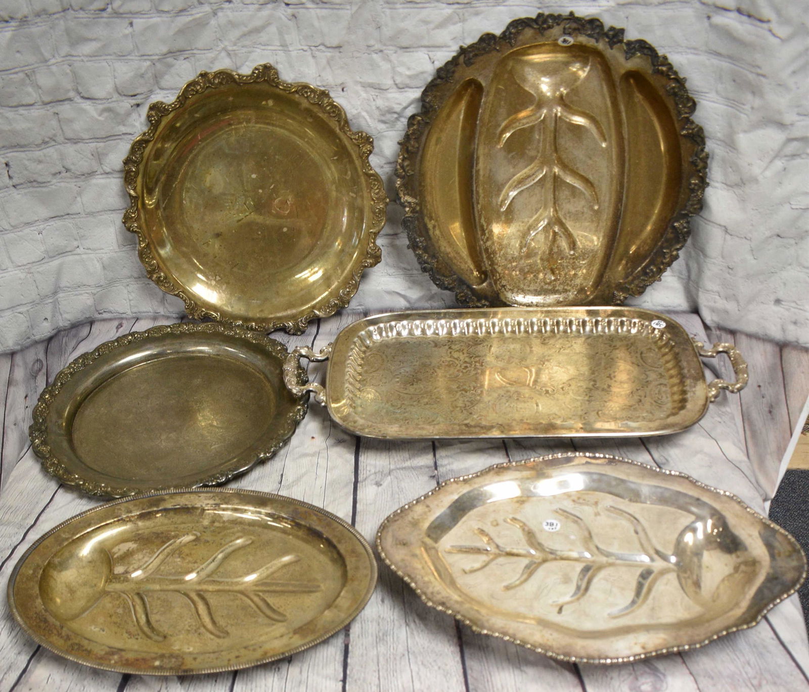 Grouping of Silver Plated Serving Trays: Largest measures approx. 24" in length. There are various style trays. Six total pieces.