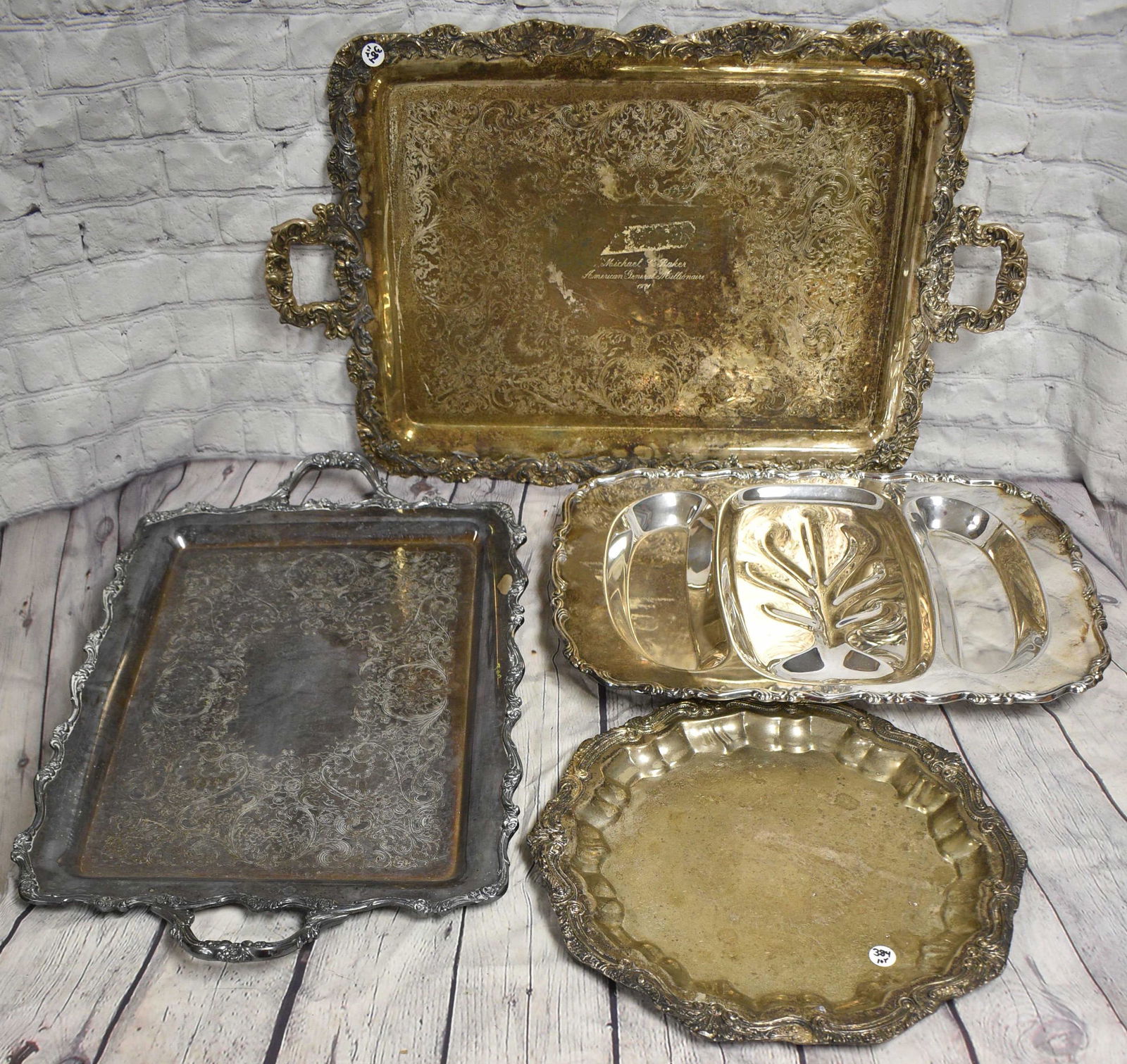 Grouping of Silver Plated Trays: Largest measures approx. 27" in length. Three total trays.