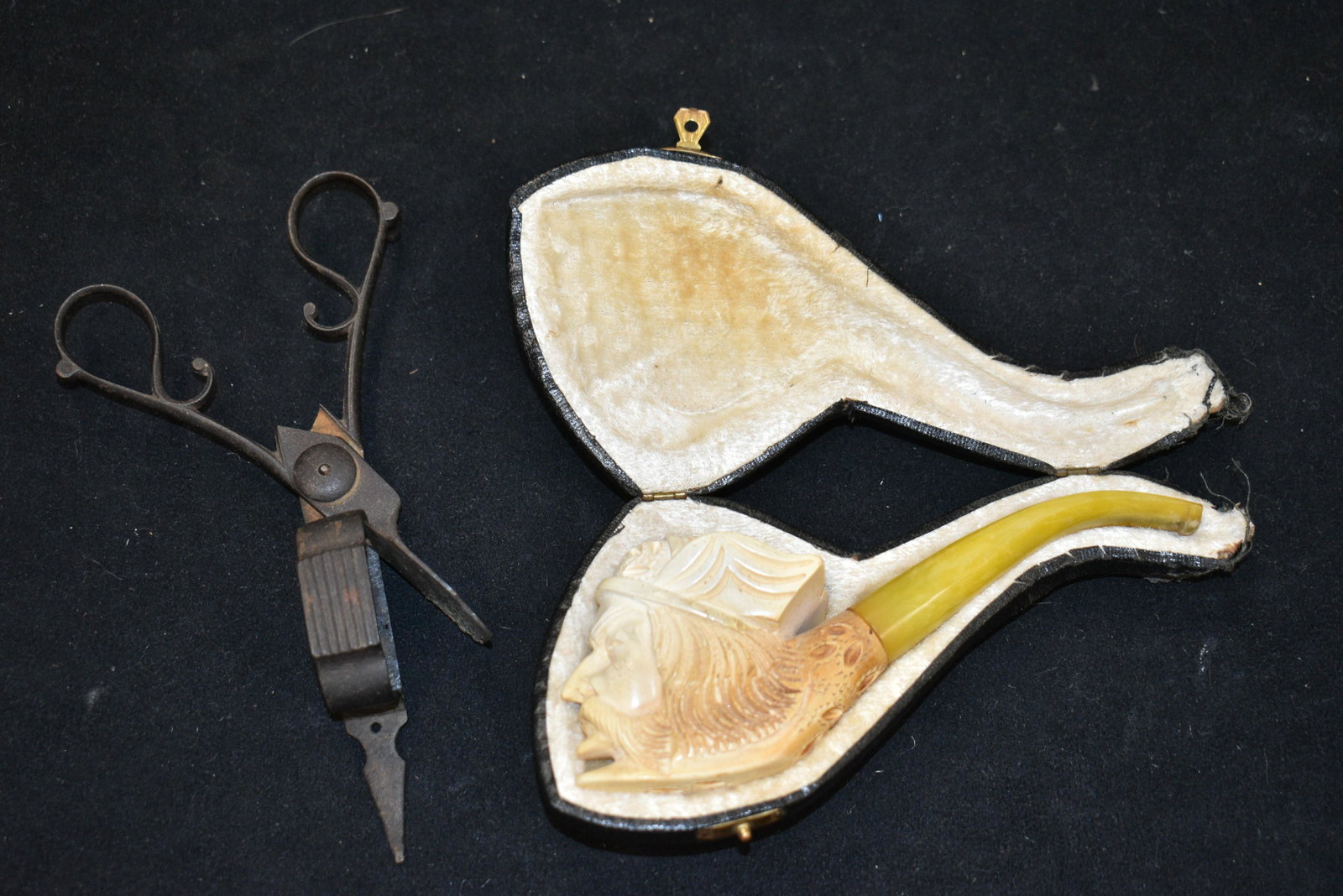 Meerschaum Pipe with a Viking Motif: Pipe measures approx. 6" in overall length. It depicts the head of a Viking warrior. It has a celluloid mouth piece and original case. Note: Case has some loss at end. Lot also includes a pair of 19th