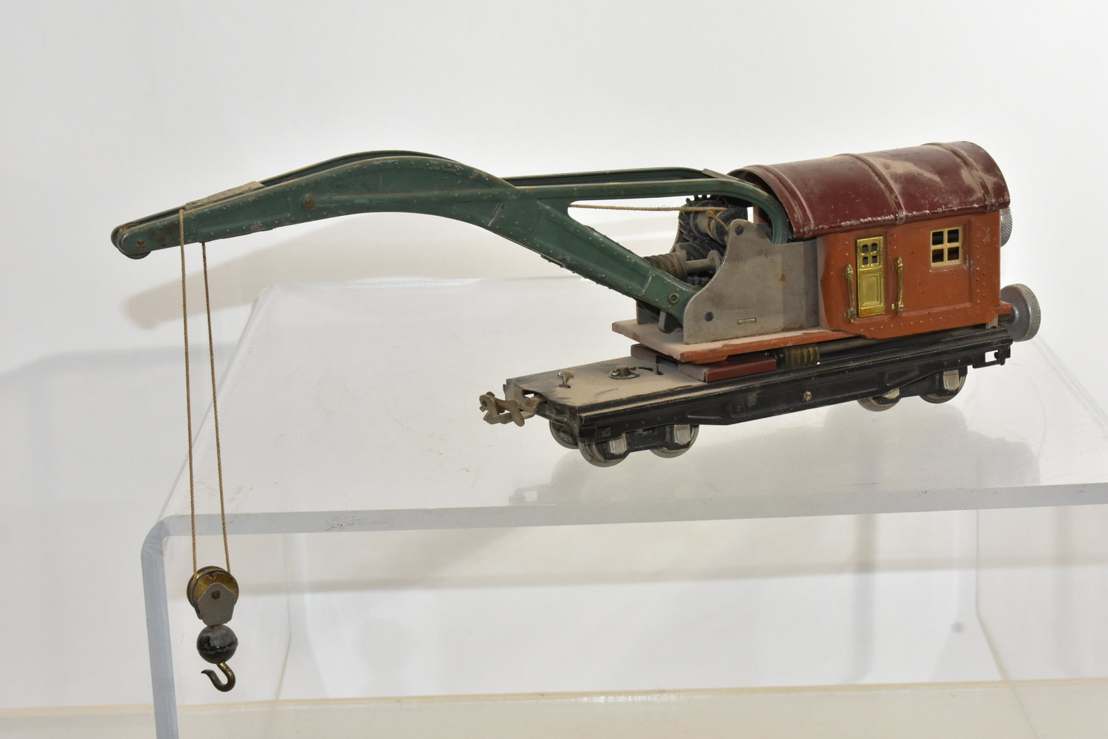 Lionel Pre War Operating Crane Car: Item has original paint, both doors and ball and pulley. It is #810 and has both brass tags on back of car.