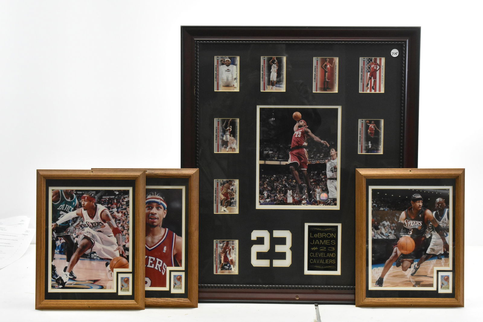LeBron James Framed Plaque and More: LeBron James sports card plaque with 10 upper deck basketball card, total size approx 23" x 27", and three Alan Iverson pictures with commemorative stamps. Frames have screw holes.