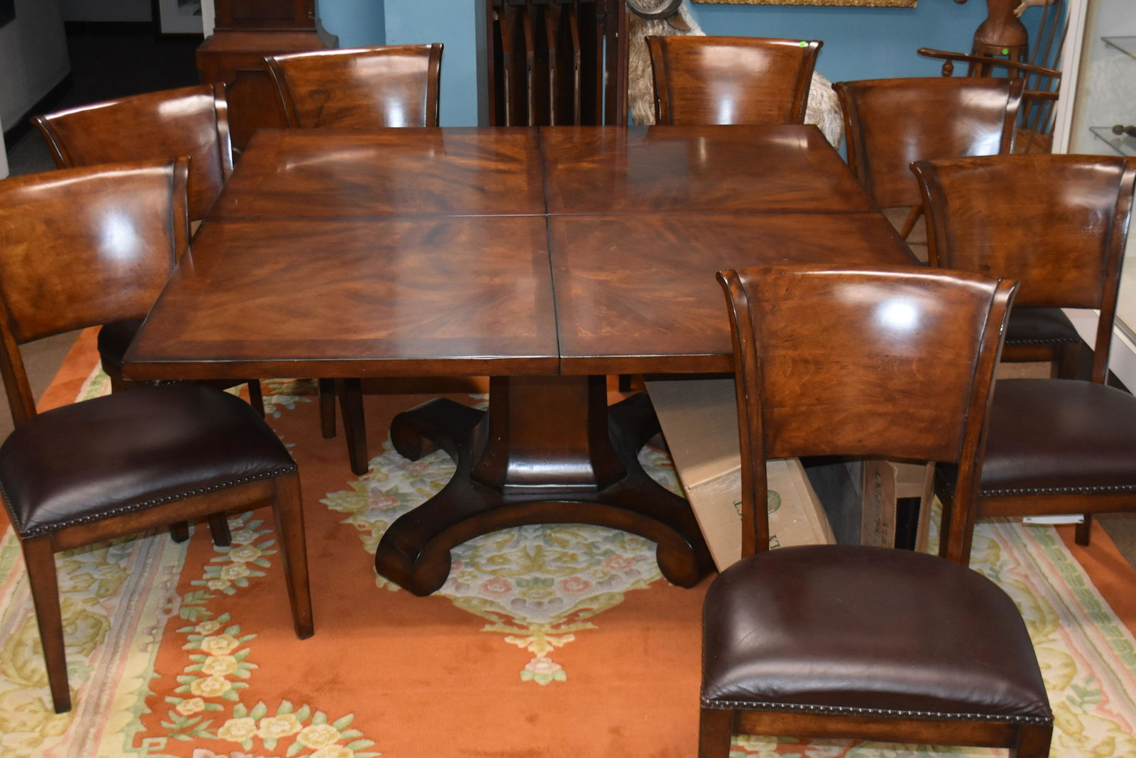 Large Conference Table with Seven Chairs: Dining room or conference table made by "Fine Furniture Shanghai" . Darker wood matches the chairs. Also includes a separate pedestal with a door to store 4 table leaves. The 4 leaves fit in a cross p