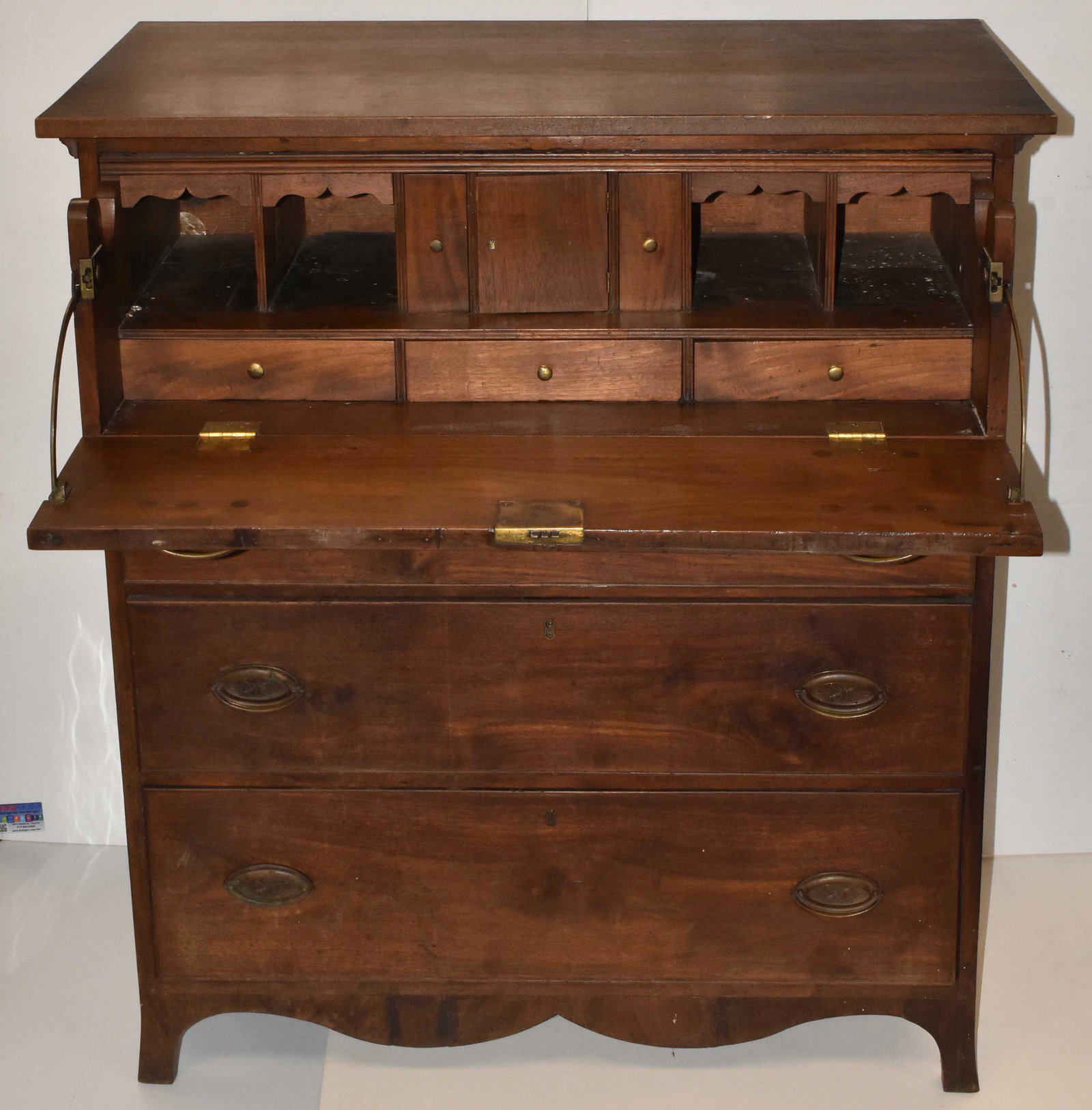 Federal Walnut Chest of Drawers/Secretary Desk: Federal chest has a drop down desk with fitted interior over three drawers, swag apron, and French feet. Reportedly owned by Mary Virginia Wade (Ginnie Wade the only civilian shot in Battle of Gettysb