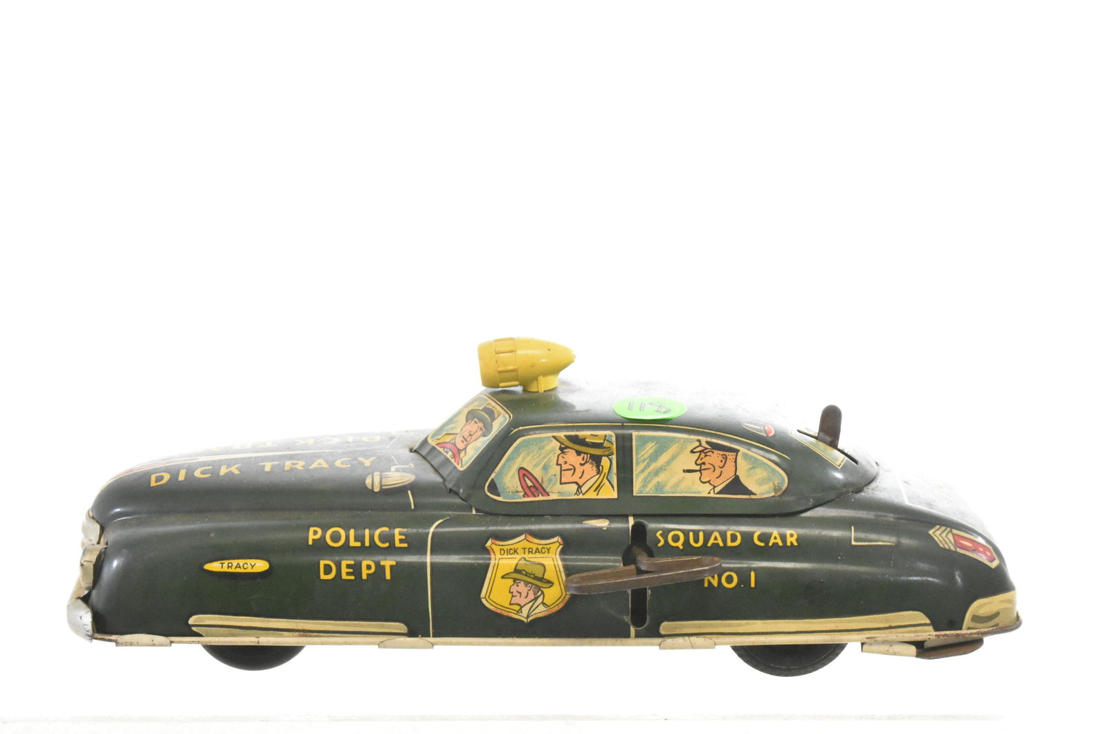 Vintage Marx Dick Tracy Wind Up Squad Car #1: Measures approx. 11" in length. It is a tin wind up toy by Marx and is functional Lithography is good, retains grill and light on top of car. Missing light bulb and cover to light battery box.