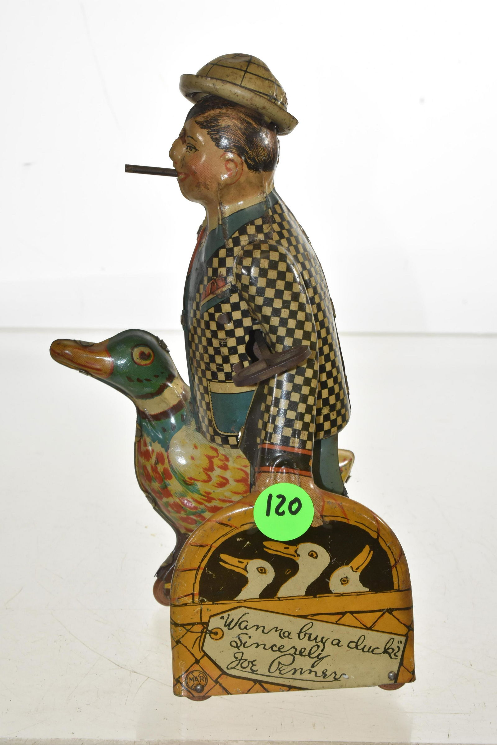 Early Marx Joe Penner Tin Litho Wind Up Toy: Measures approx. 8 1/2"h. It is a functional wind up toy. When wound up, Joe walks and his hat and cigar move up and down. Good lithography and both duck and basket have original wooden wheels.