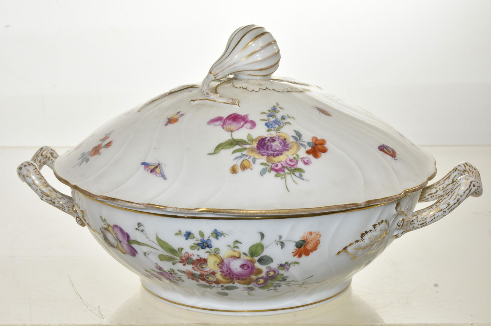 Pat sur Pate Hand Painted Covered Vegetable: Measures approx. 6"h x 11" handle to handle. It is hand painted with flowers, butterflies and insects and has the crossed sword mark below a crown on bottom.