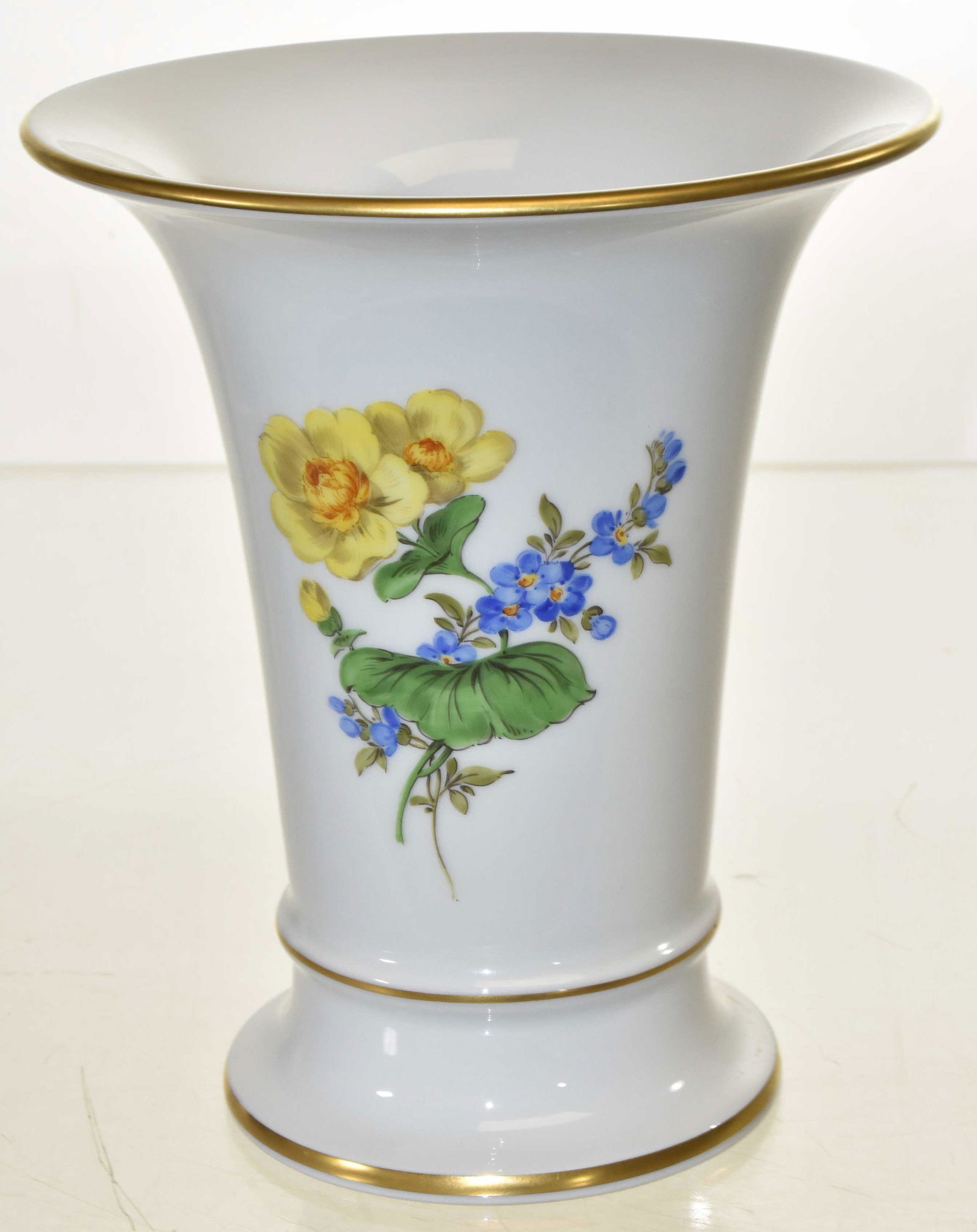 Meissen Hand Painted Vase: Measures approx. 6 1/2"h. It has a hand painted floral design and good gold flashing. Item has Meissen crossed sword mark on bottom.