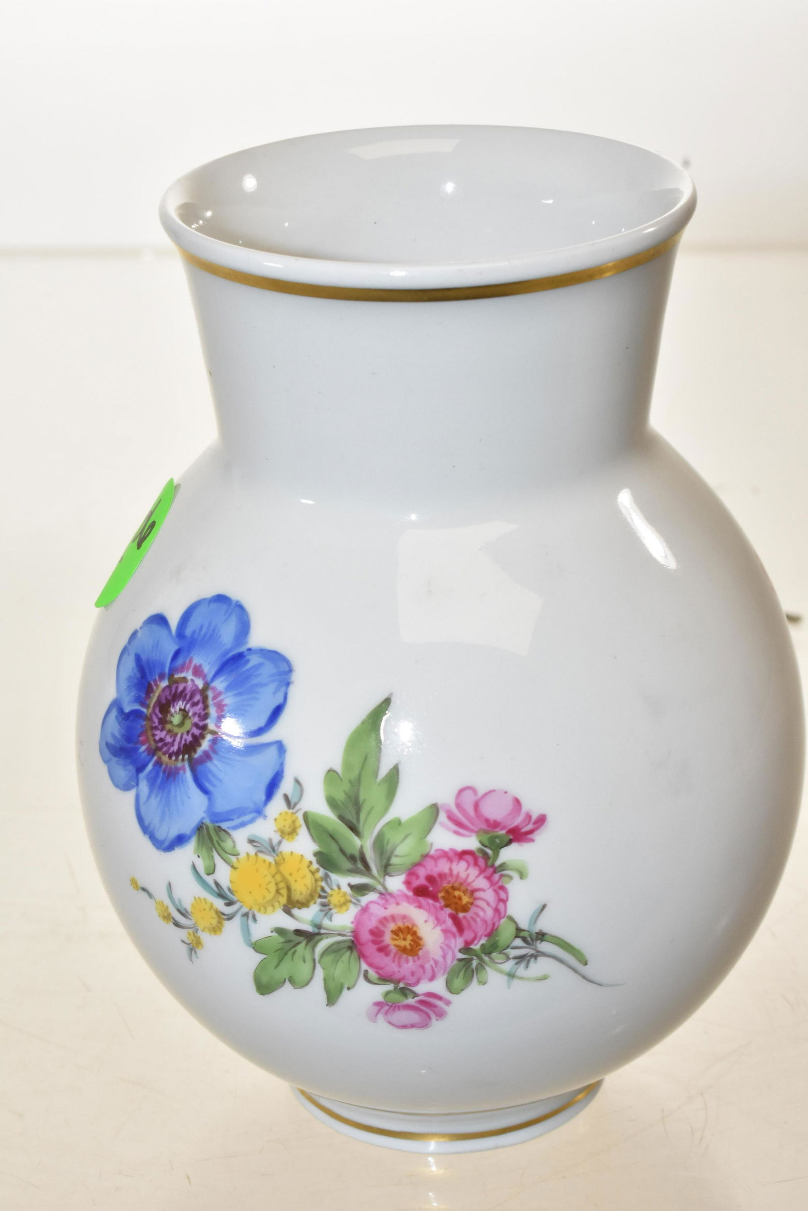Hand Painted Bulbous Meissen Vase: Measures approx. 5"h. It has a hand painted floral design and good gold flashing. Item has the Meissen crossed sword mark on bottom.