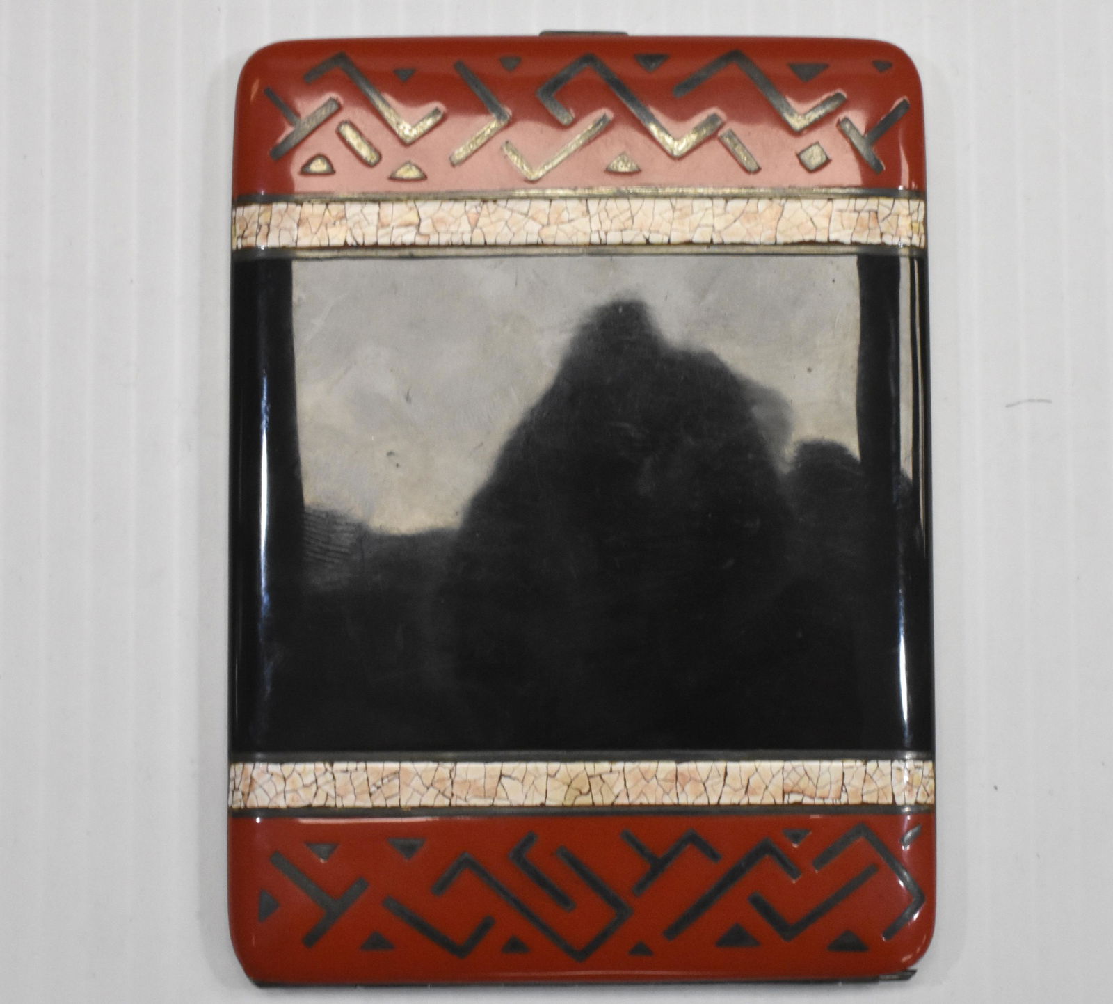 Art Deco Sterling Enameled Cigarette Case: Measures approx. 4 3/4" in length. It has a geometric red, white and black enameled top with a strong Art Deco design. It has a black enameled back and is marked "Sterling Germany".