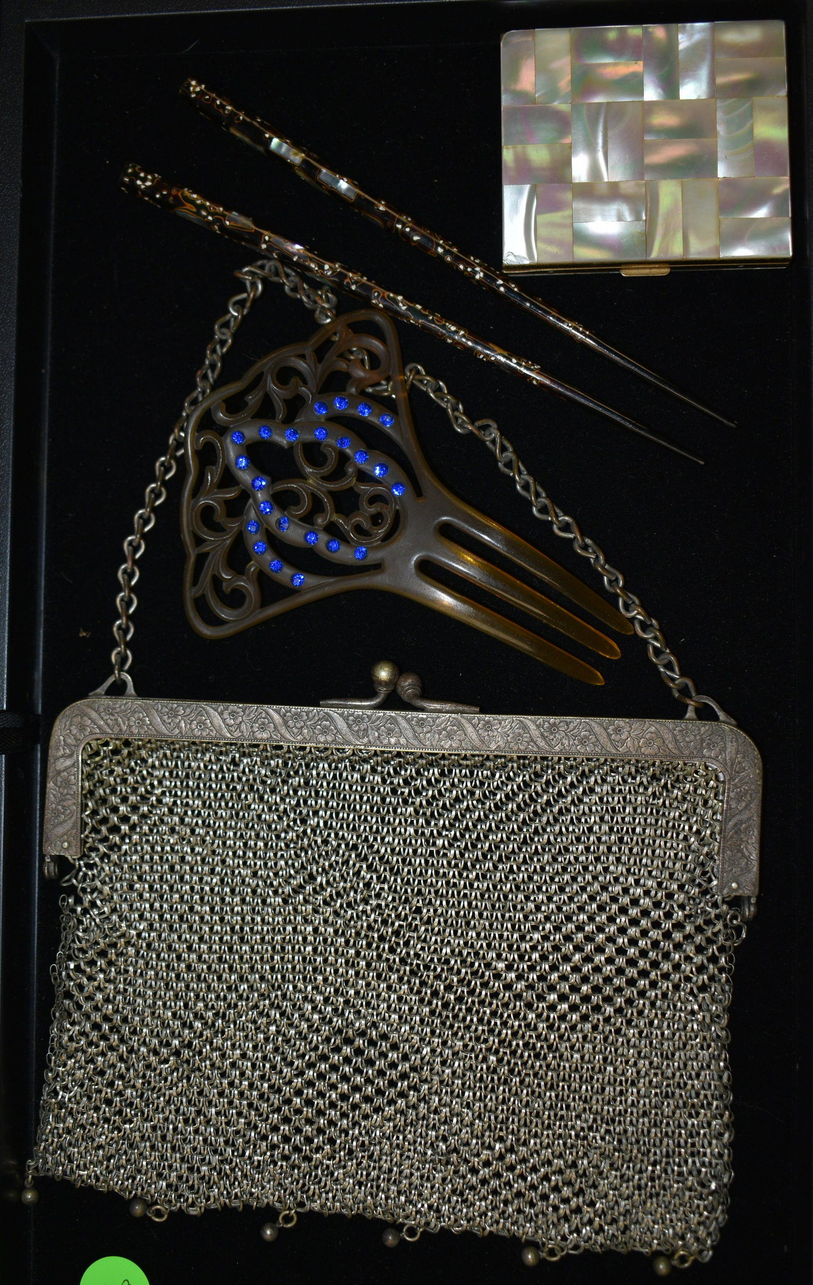 Eclectic Collection: includes antique mesh purse, celluloid and rhinestone haircomb, mother of peal compact, and chopstick hair ornaments.