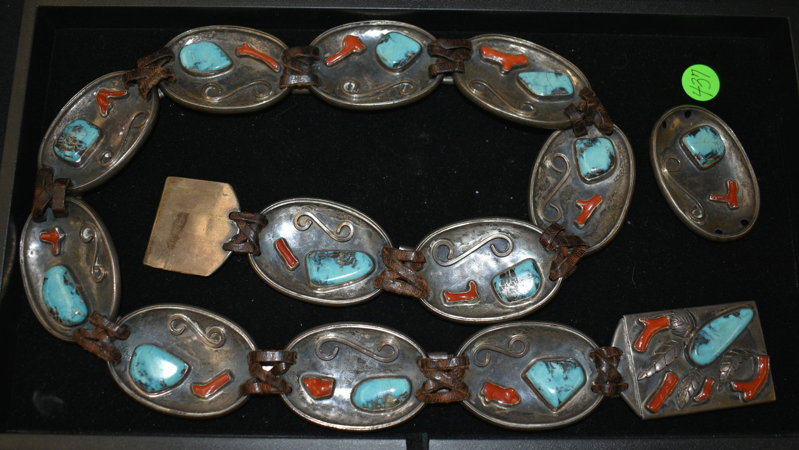 Old Pawn Native American Belt: Sterling belt has 13 oval design panels with large turquoise nuggets and long red branch coral forms in each one with square buckle and leather detail. Signed by Lucille and Chuck Cooper. Approx 37 1/