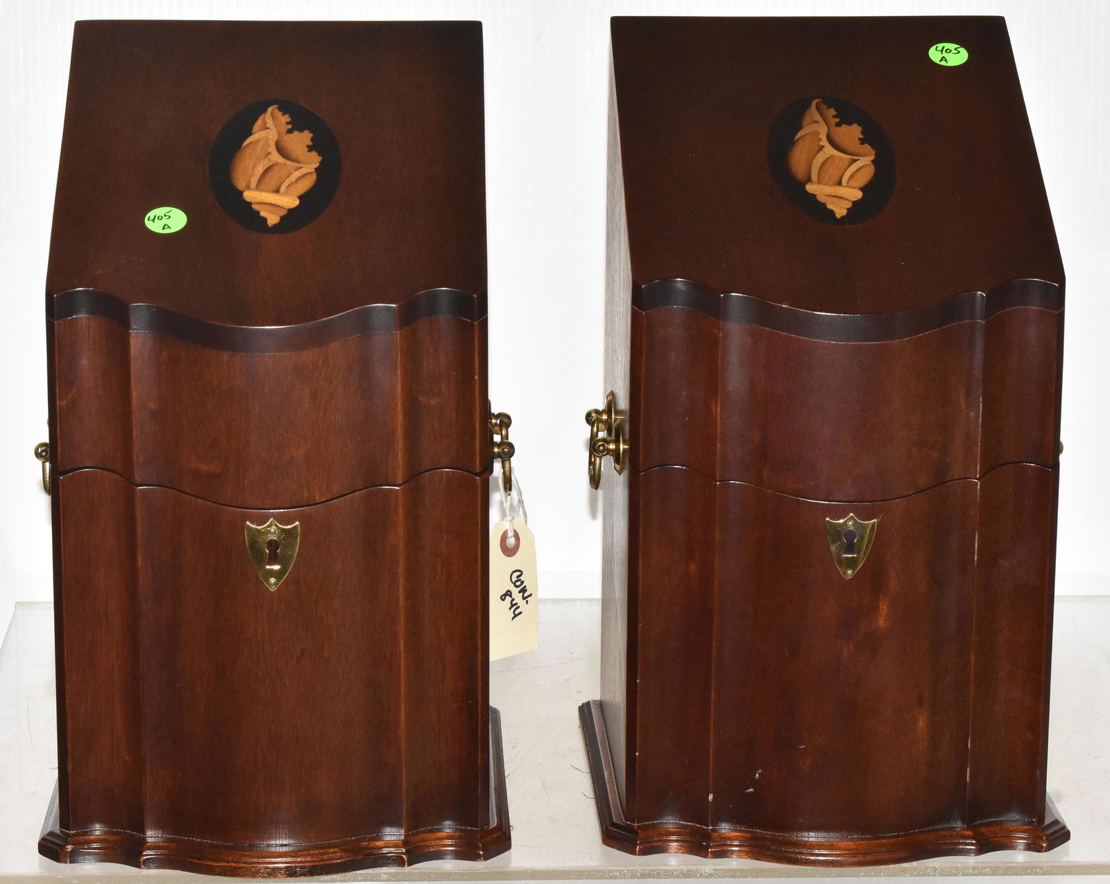 Wood Knife Boxes attributed to Kittinger (Pair): Each measures approx. 15"h. They are mahogany construction with shell inlay, brass hardware and six interior felted compartments. Pair is contemporary in like new condition.