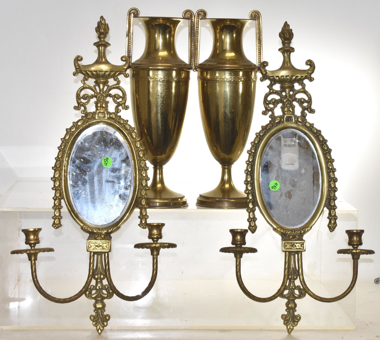 Brass Wall Sconces and Vases: Sconces measure approx. 23"h. They have beveled mirrors and were manufactured by "Glo-mar". Lot also includes a pair of brass vases measuring approx. 14 1/2"h each.