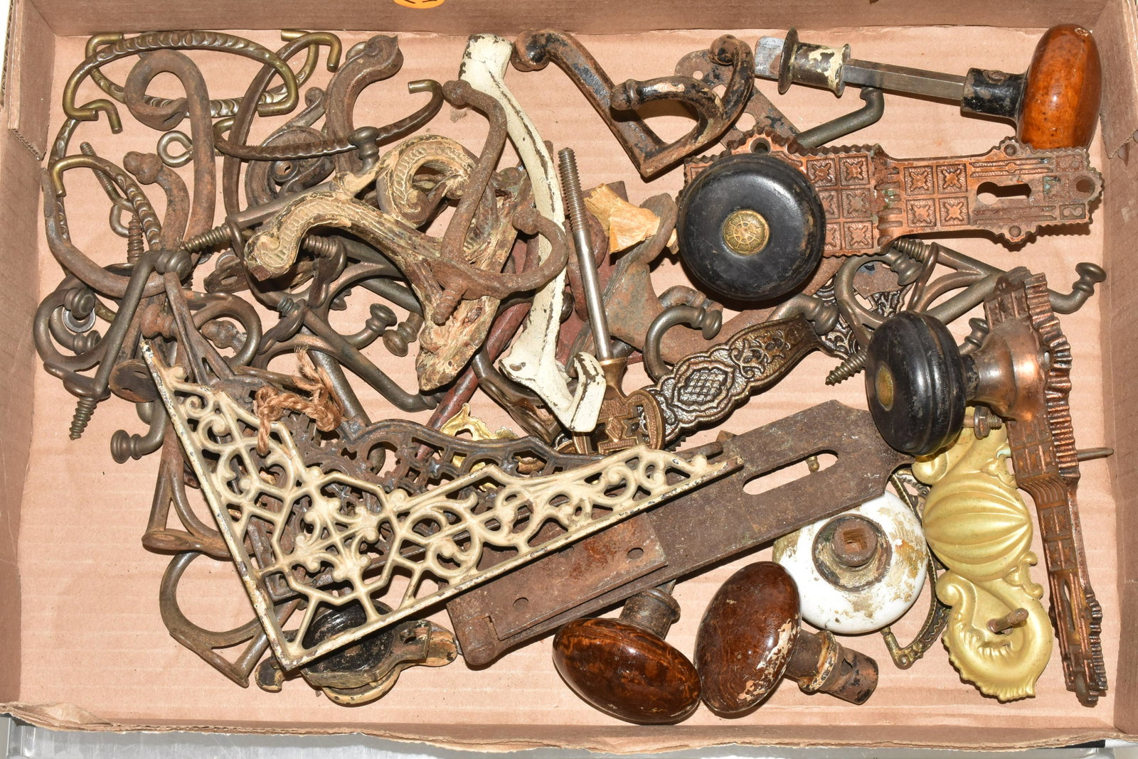 Collection of Vintage Hardware: Including a wide selection of coat hooks, two wooden door knobs with brass back plates, Bennington door knobs and more