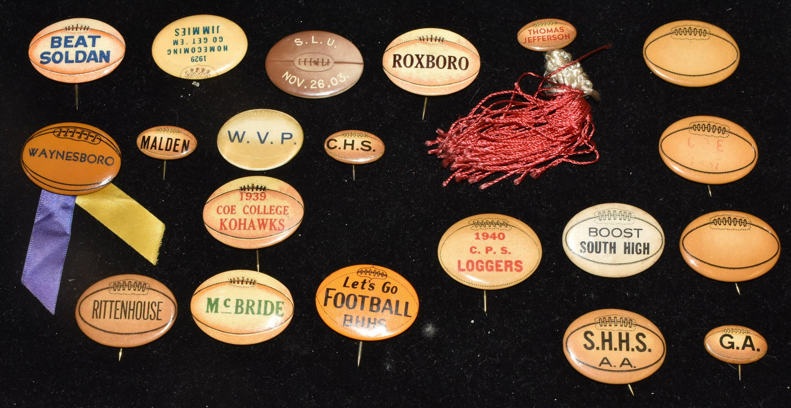 Twenty Old High School Football Pin Backs: Including "Coe College 1939" with paper label on back, "Rocksboro" with paper label on back, "C.P.S. Loggers 1940", "Thomas Jefferson" with ribbon and paper label and various others.