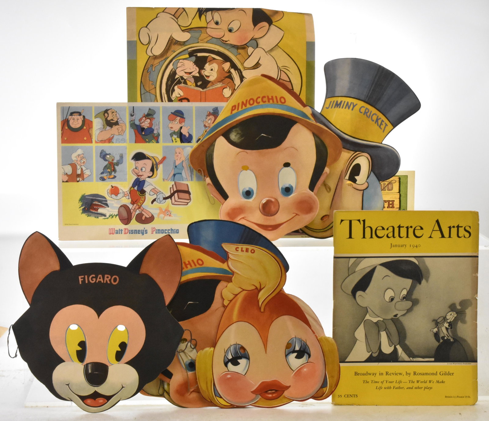 Pinocchio Ephemera: Includes 2 sets of Pinocchio paper masks. One set has 5 masks and the other has 2 masks. Walt Disney Pinocchio Perry Theatre promotion. Pinocchio "Good Teeth" certificate 1939. Pinocchio Children's Bo