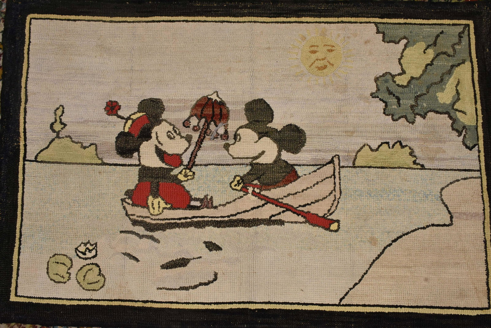 Early Disney Type Hooked Rug: Rug features early Mickey and Minnie Mouse Rowing in a boat. Measures 29" x 44". Center has a fabric pull, some loss to border, and some discoloration.