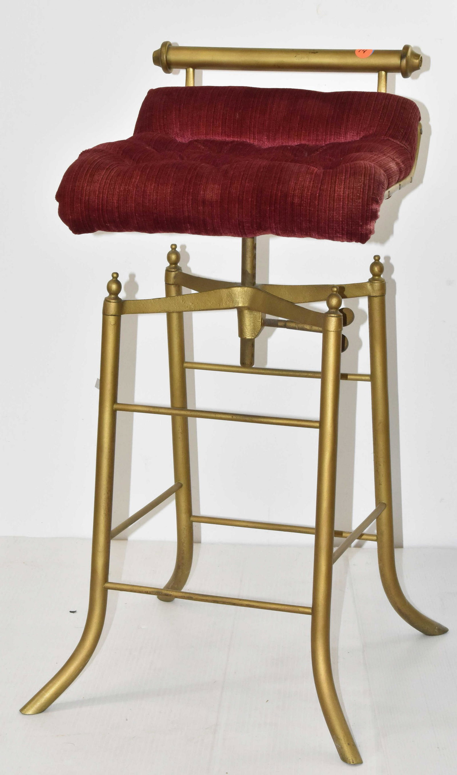 Adjustable Vanity Stool: Measures approx. 28"h at final adjustment. It has a metal frame with a padded seat in good condition. Item is a "Simplex" brand and was produced by "C.H. Hare" catalog #1644.