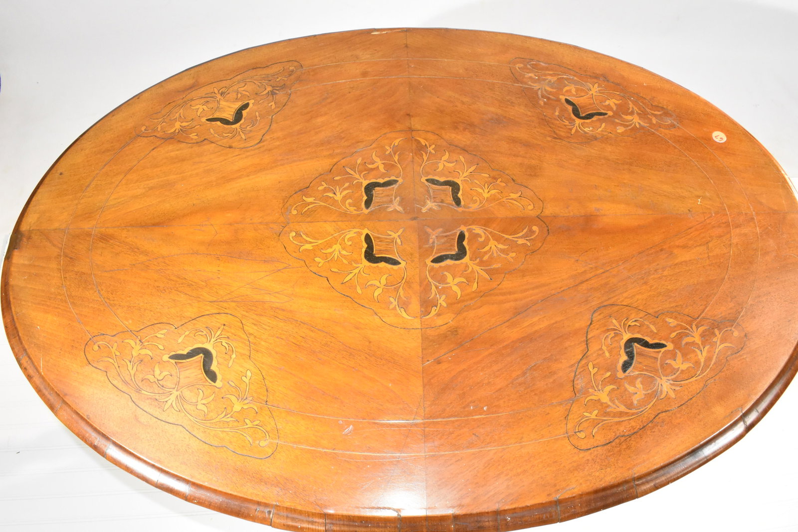 19th Century Table with Marquetry Inlaid Top: Measures approx. 26"h x 40"w x 29"d. It has a well executed decorative inlaid top, stands on a five pillar frame and has decorative legs. From the estate of George Meade Easby of Chestnut Hill, Pa the