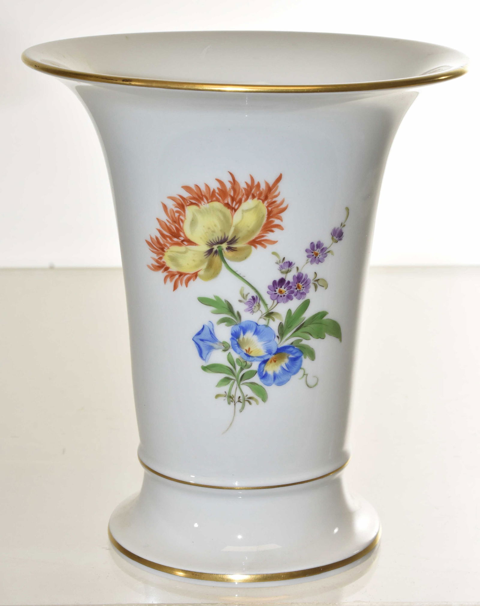 Meissen Hand Painted Floral Vase: Vase measures approx. 6 1/2"h. It is a hand painted floral vase with good gold flashing and a Meissen crossed sword mark on bottom.