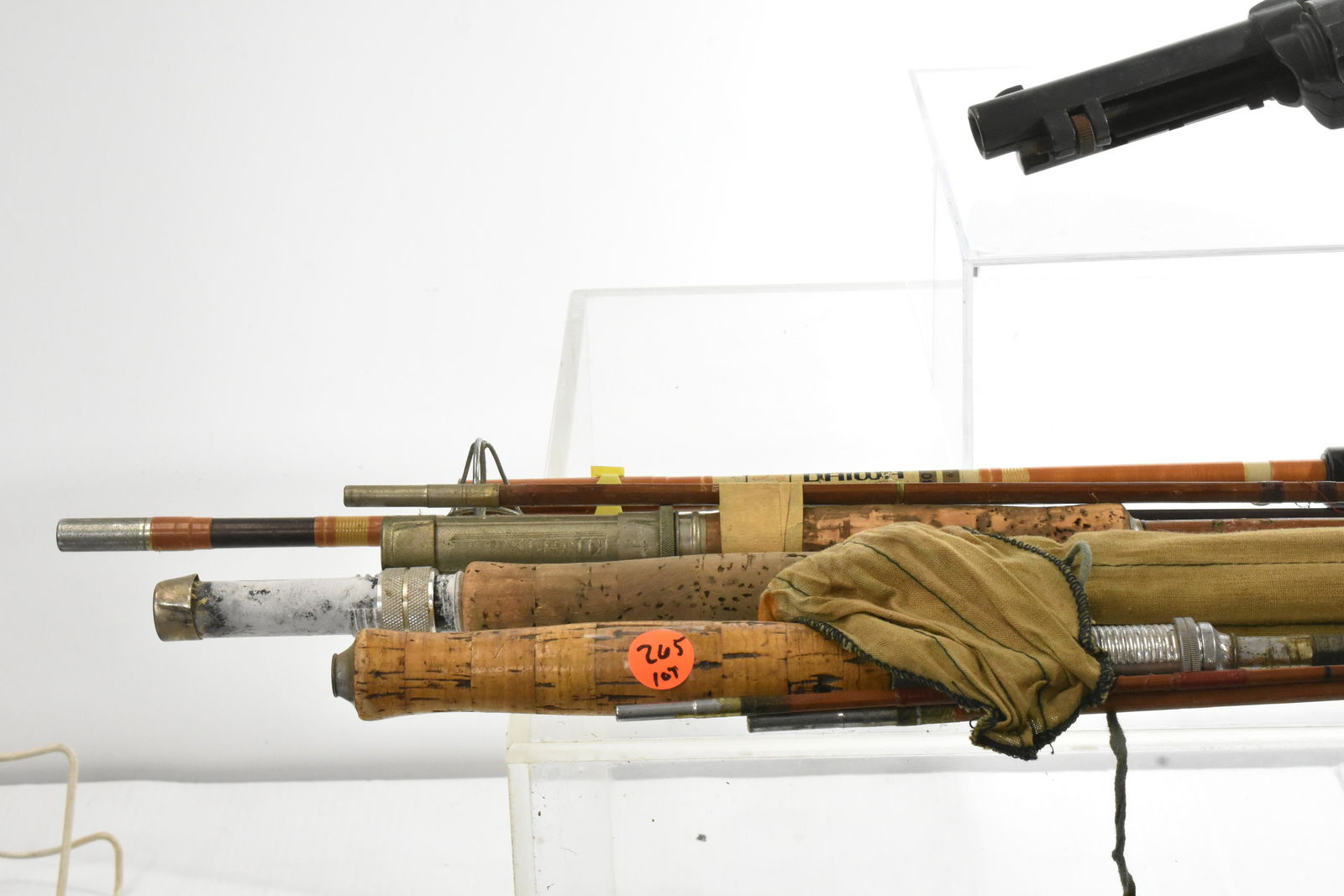 Bamboo Fly and Bait Casting Rods: Three vintage bamboo fly rods - two unknown makers and one with bag reading "Governor 8 1/2 foot. Lot also includes a contemporary Daiwa #3012 bait casting rod. Also includes a Hahn 45 cal. toy pistol