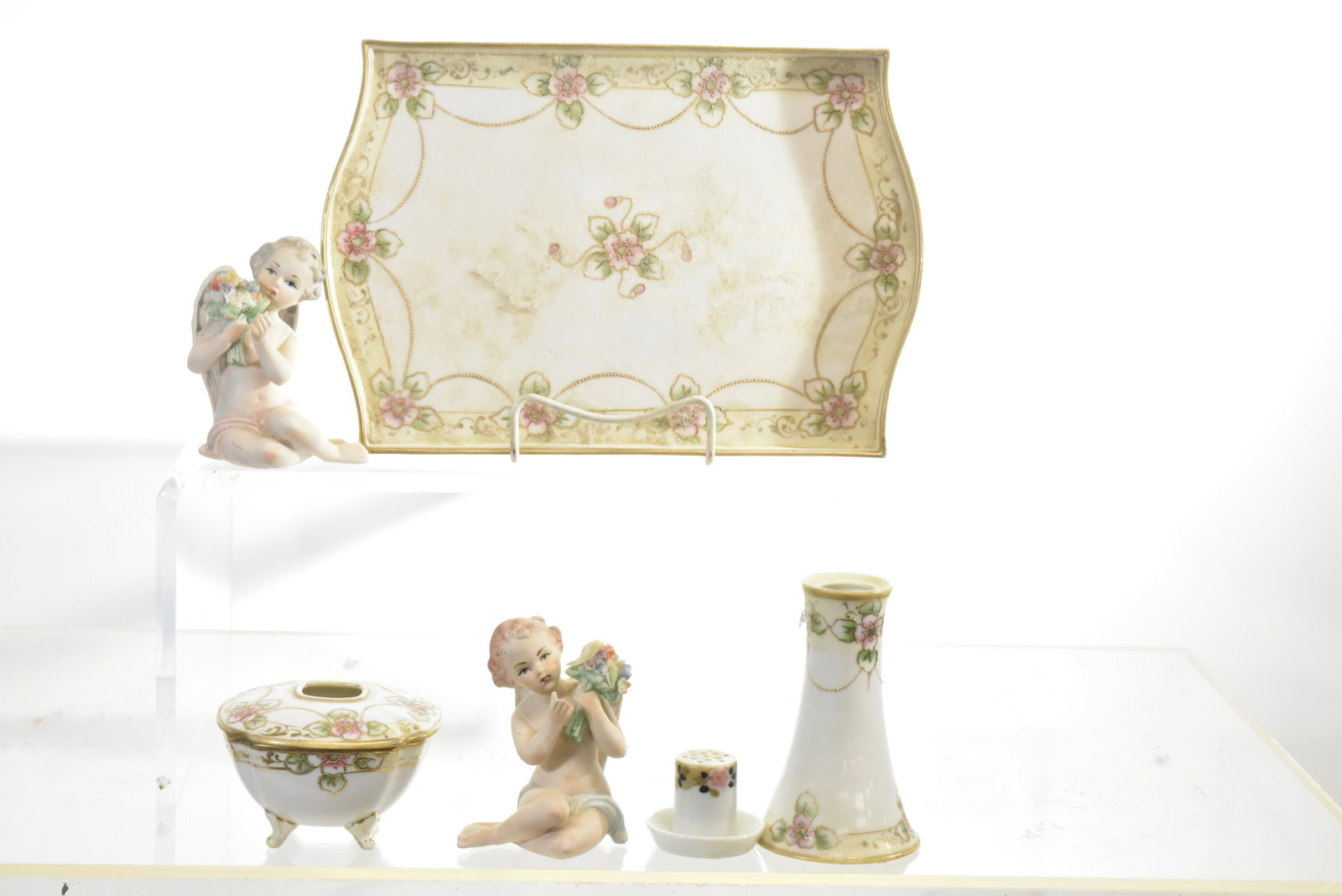 Hand Painted Nippon China and more: Including a hand painted tray measuring approx. 10 1.2" in length, two stick pin holders, a hair receiver and two angel figures marked "Japan".