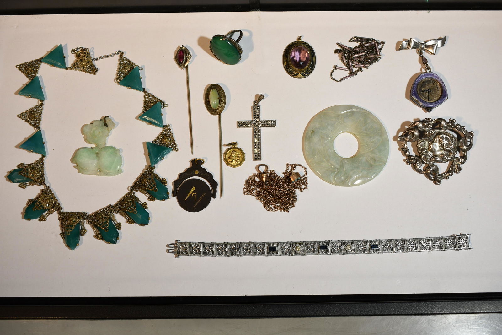 Victorian Art Nouveau Estate Jewelry: including sterling silver and enamel Bucherer. Enamel pendant watch with matching purple enamel long chain and rose detail on the reverse of the watch. Art Nouveau sterling maiden brooch, green celado