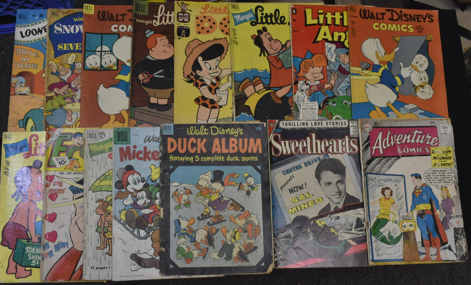 Collection of 10 Cent Comics: Fourteen 10 cent comics including Walt Disney comics, Little Lulu, Snow White and a Superboy comic that shows wear to cover. Some 10 cent #s are: Mickey Mouse #52, Snow White #382 (poor condition), Do